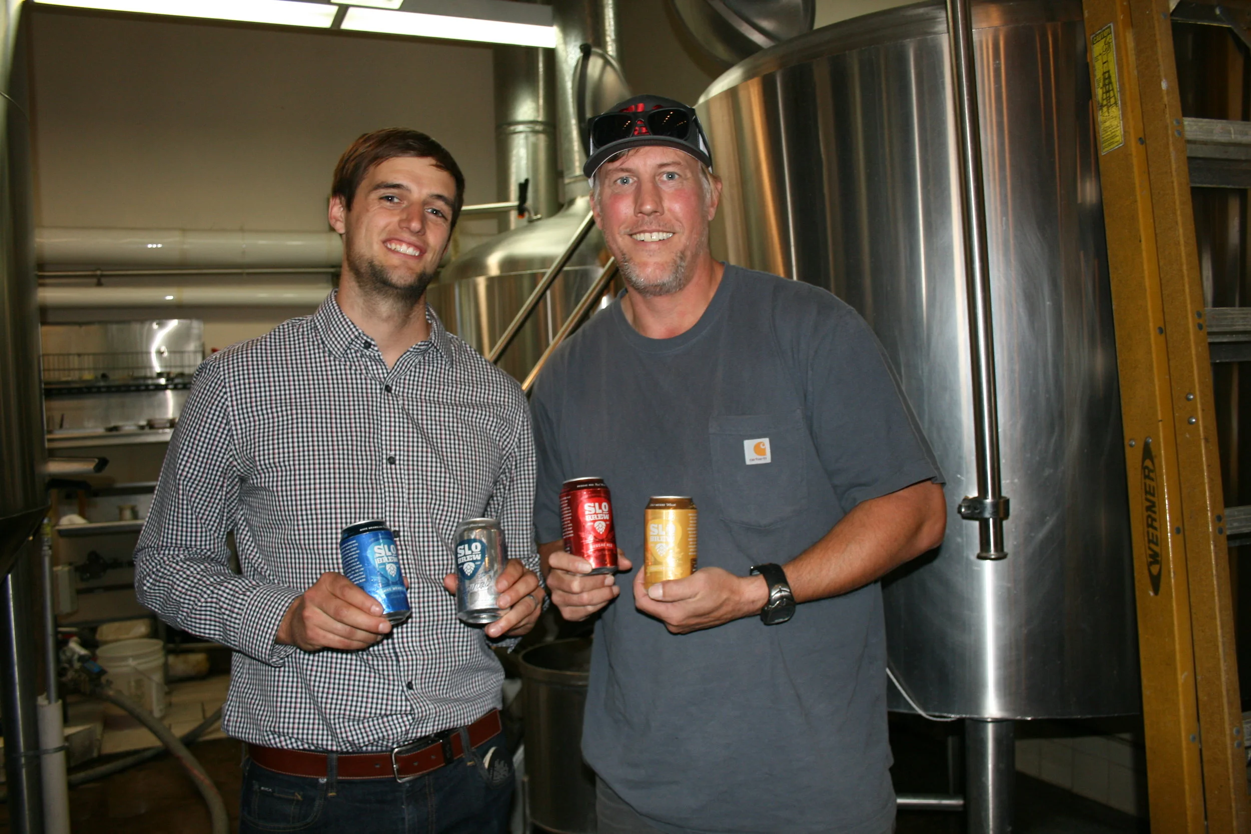 WE CAN DO IT From left, SLO Brew Director of Marketing Brian Kerr and Brewmaster Steve Courier showcase their new 23-ounce cans.