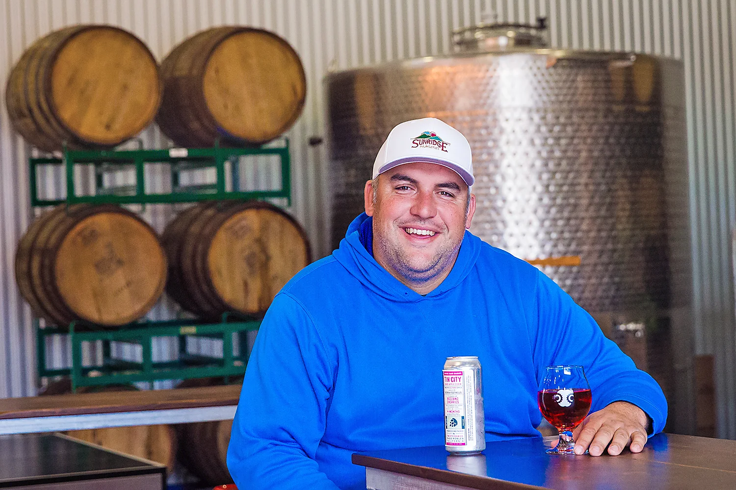 TIN MAN Andrew Jones, winemaker/owner at Field Recordings, has joined together with Mikey Giugni of Scar of the Sea and Curt Schalchlin, owner/vintner of Sans Liege, to create Tin City Cider Co. in Paso Robles. PHOTO BY JAYSON MELLOM