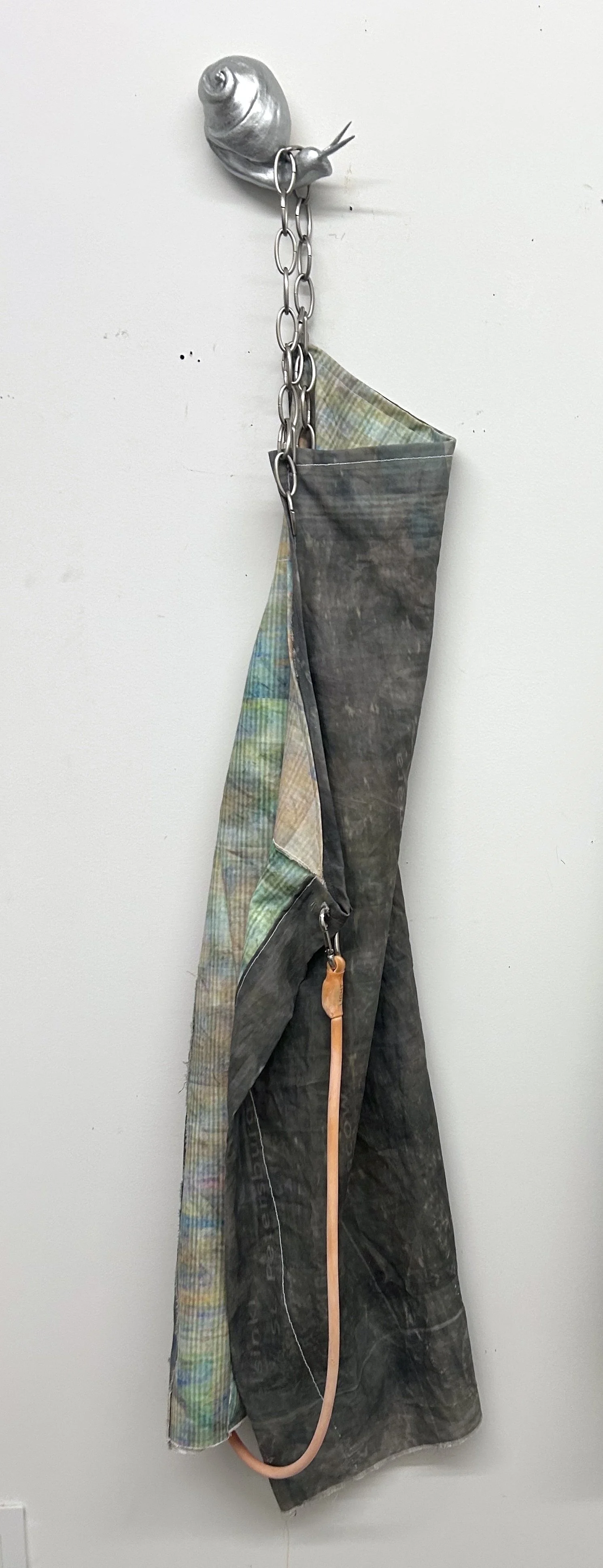 Apron no. 1, digital print on canvas, resistance band, chain, fired and glazed ceramic sewing