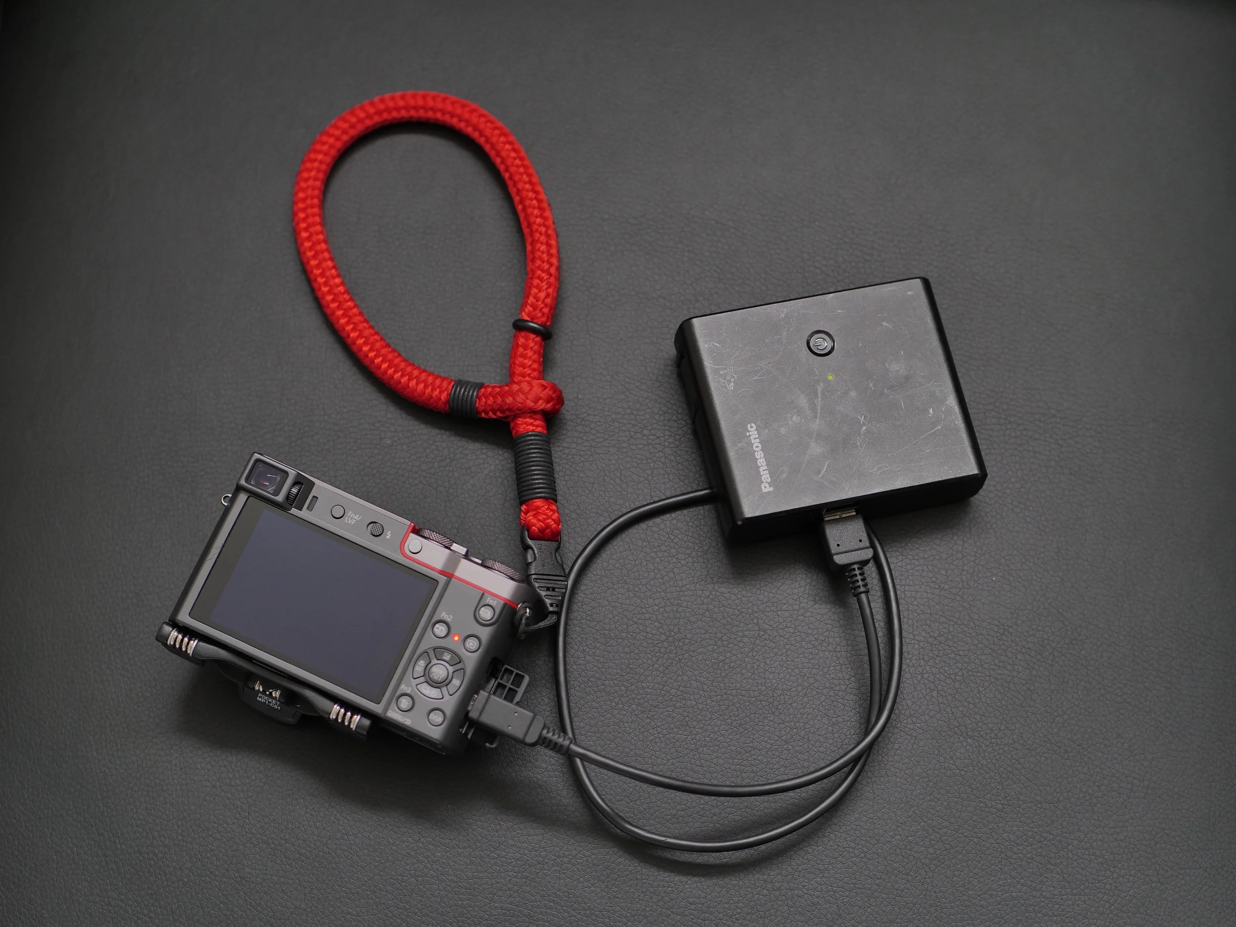 With two USB ports the Panasonic hybrid charger replaced my Mophie, iPhone and ZS100 charger.