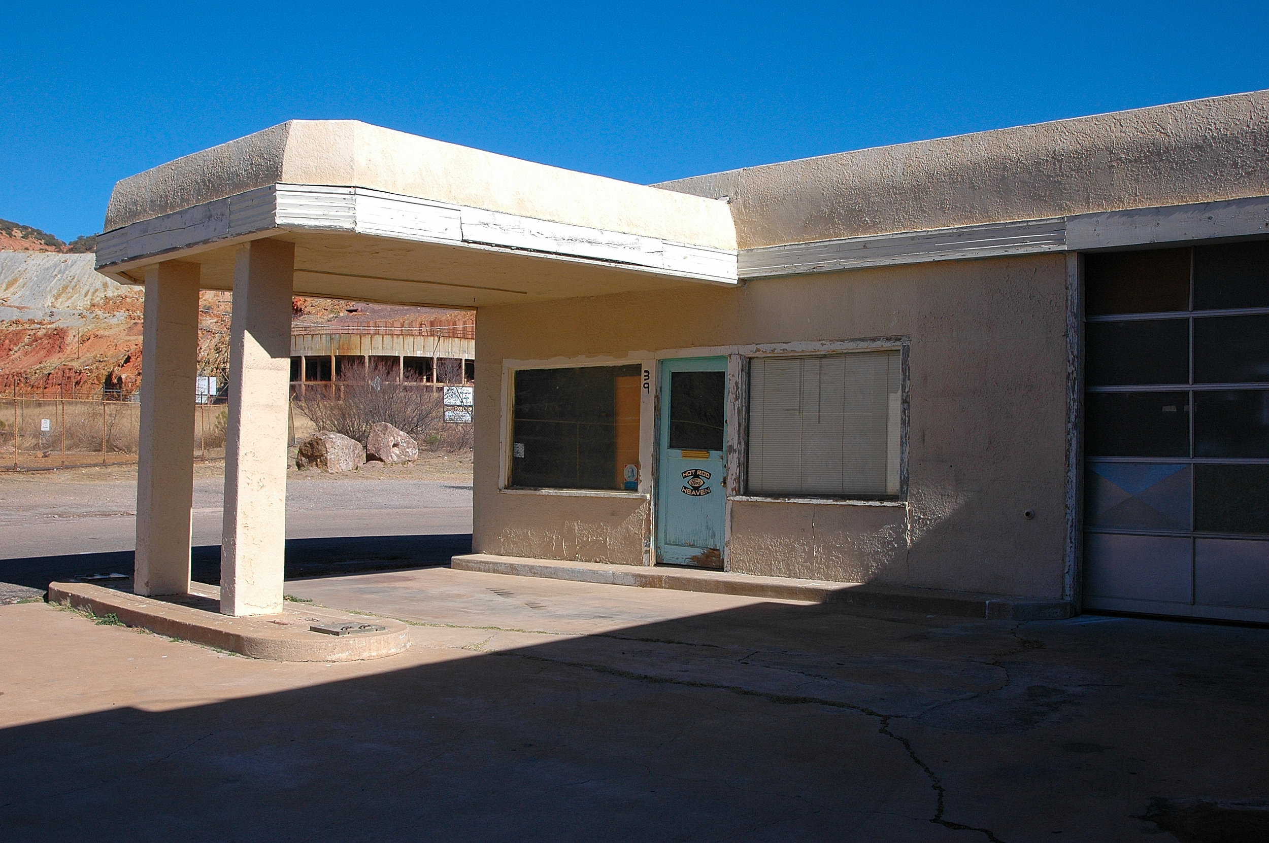 Abandoned gas station, although it appeared a hot rod business had operated here recently.