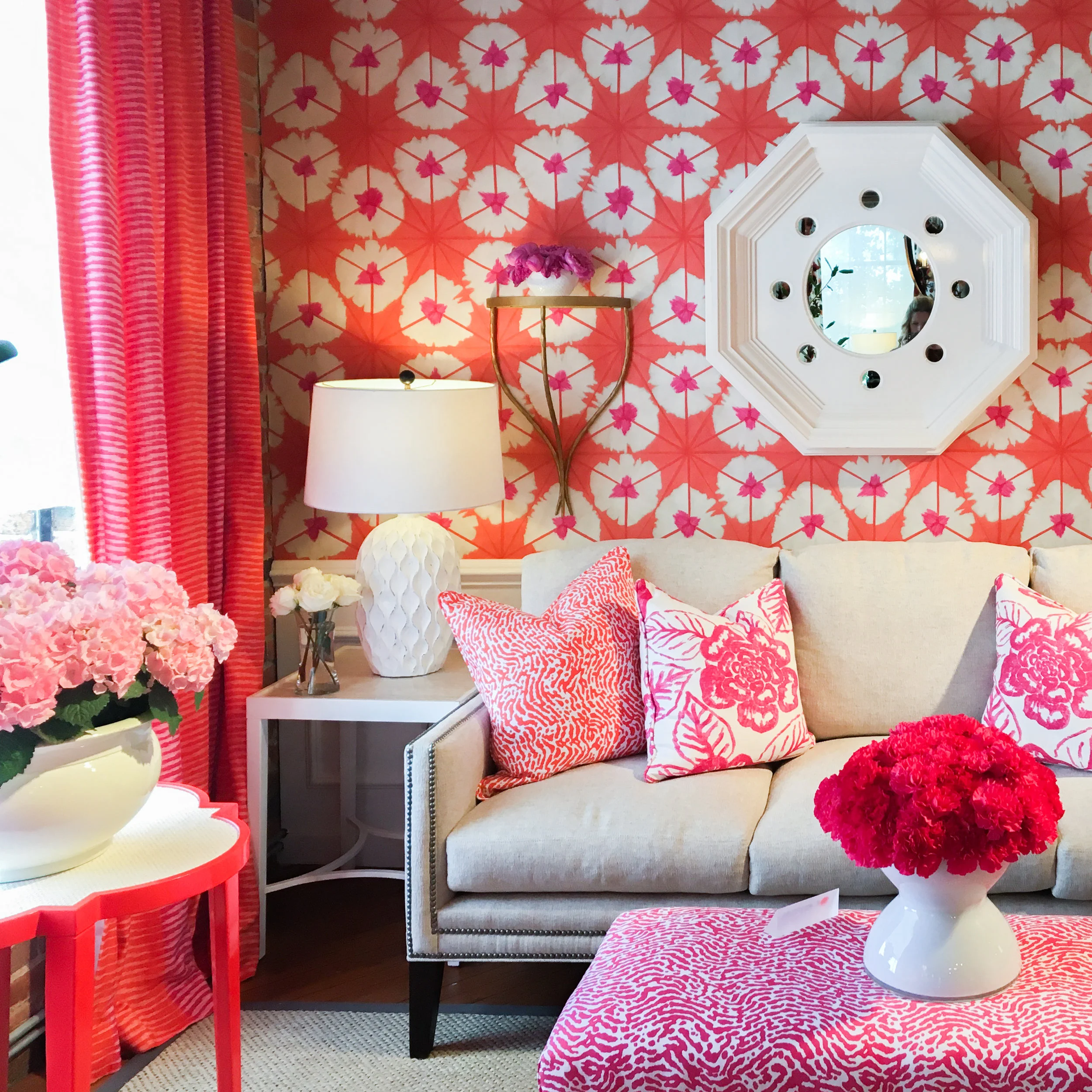 Thibaut's use of color and pattern is inspiring. Reds, oranges and pinks look sophisticated in this living room design.