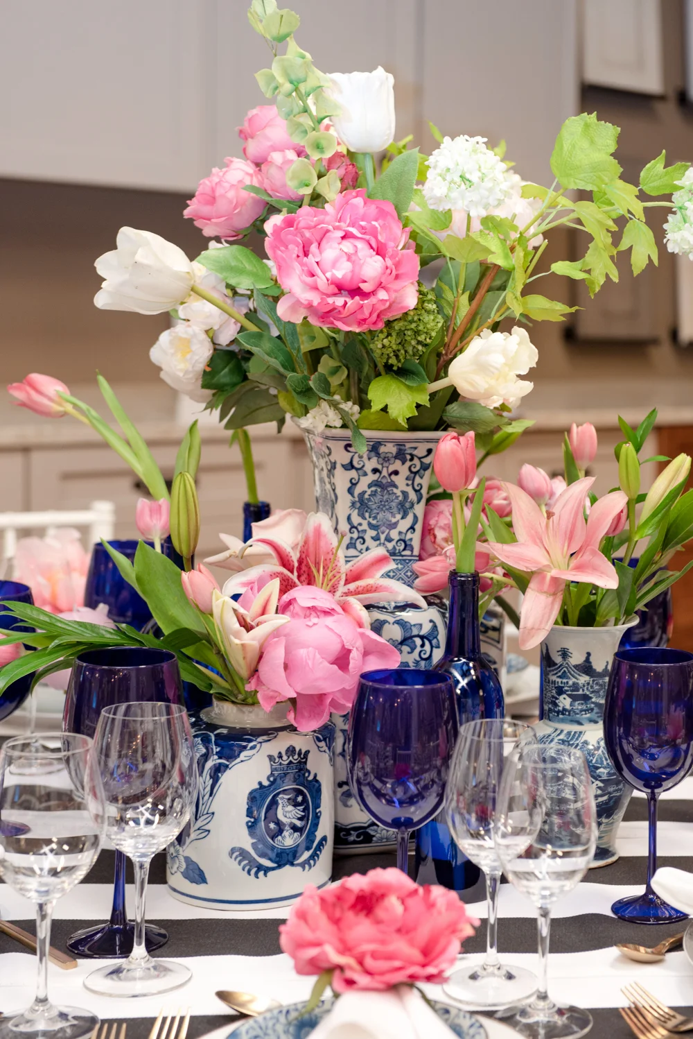 Flowers, black and white stripes, gold flatware and blue accents dressed our tables to the nines while keeping a relaxed and fresh summer feel.