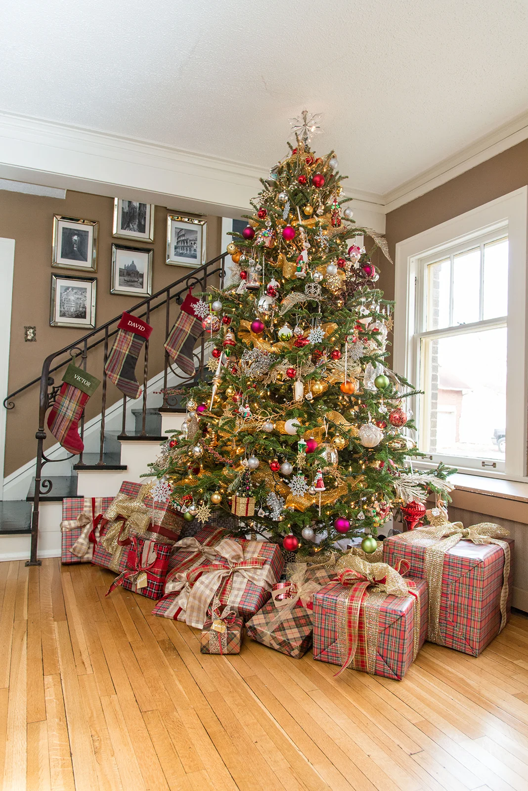 A color palette of red and gold, glass ornaments, plenty of ribbon and a bit of electric flare our tree gives our tree the perfect balance of formal and fun.