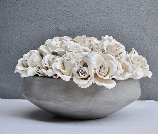 &ldquo;Rose&rdquo;
Cream roses are said to represent thoughtfulness, charm and gracefulness. These hand painted cream roses secured in a concrete vessel create a modern yet classic art piece. 

Perfect for a coffee table, console, dining table or a s
