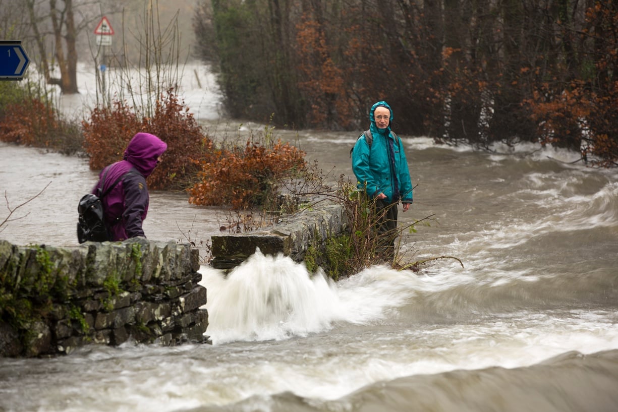 Walkers trying to cross raging floodwaters on the Ambleside to Coniston road at Rothay bridge Photograph: Ashley Cooper / Barcroft Media http://www.theguardian.com/uk-news/gallery/2015/dec/05/storm-desmond-in-pictures