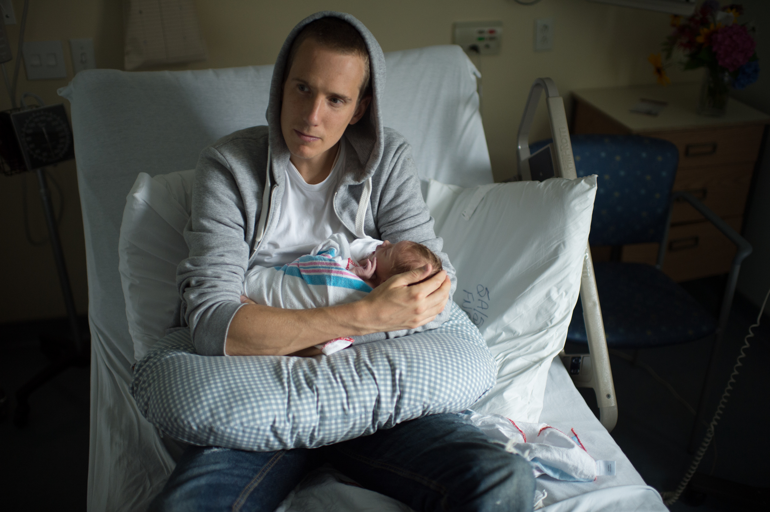 Layton and his new born son Finn. Photo credit: Jeff Cooke