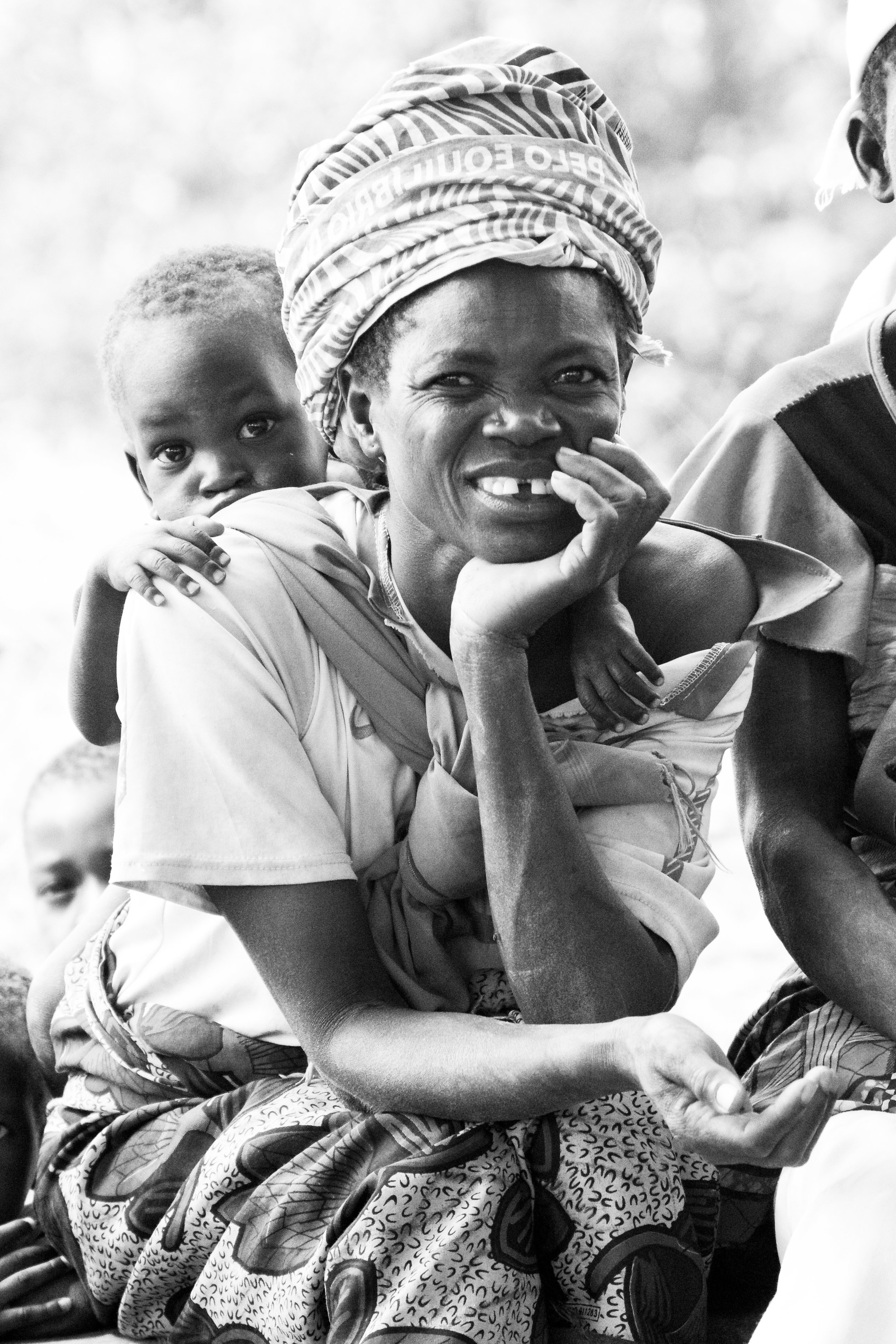 Young and old, women everywhere carried at least one baby or toddler on their back at all times.