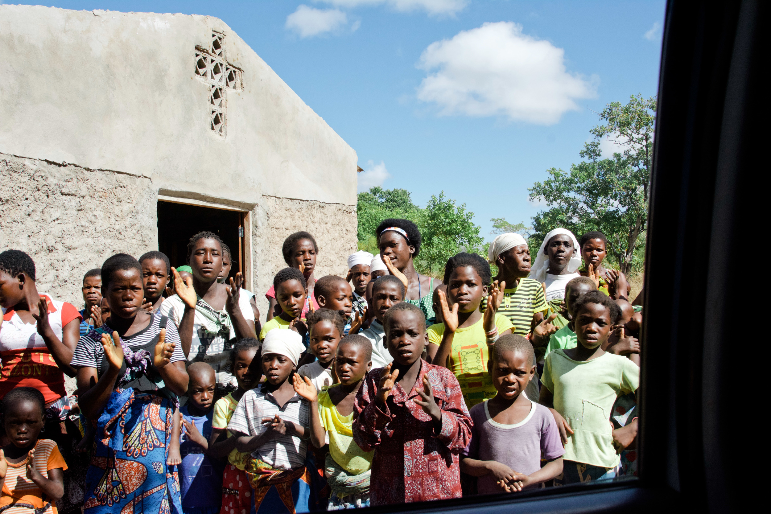 Most of the congregants are young women and children. Here, they are saying goodbye as we head to our next congregation.