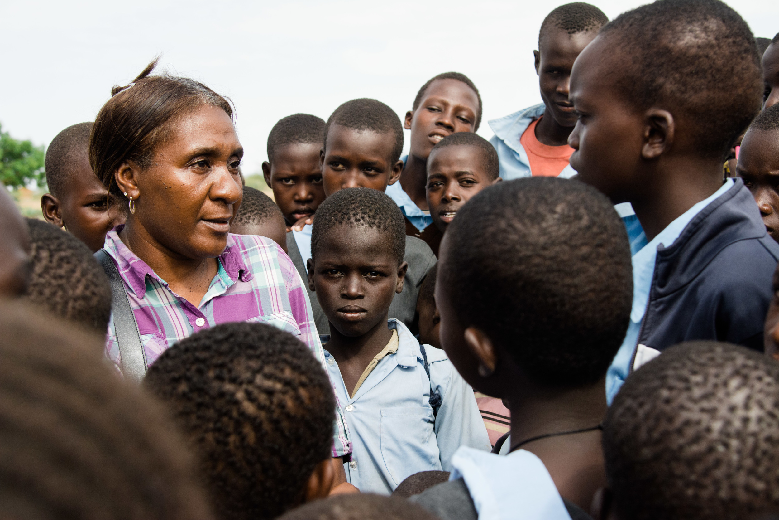 Career missionary Shara Cunningham talks to the children playing around the clinic site.