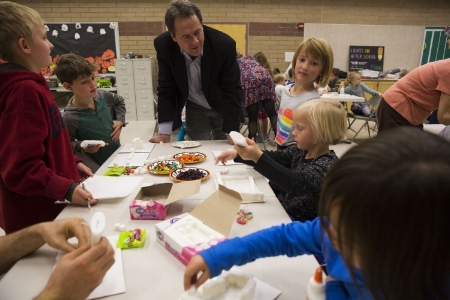 Youth make haunted houses out of sugar cubes while Governor Bullock looks on (Photo credit: Louise Johns, Bozeman Daily Chronicle)