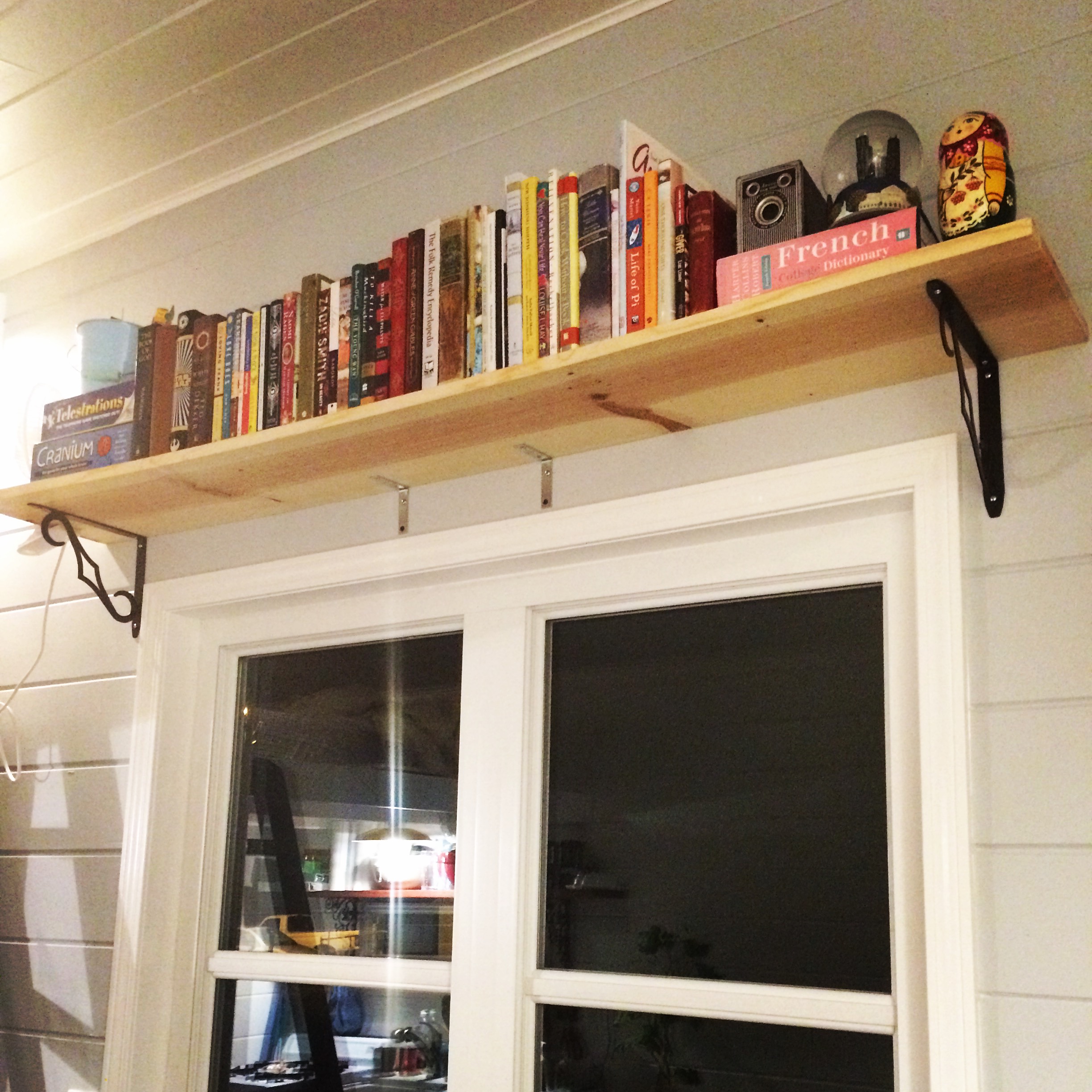  Our bookshelf above our large window in our living room. 