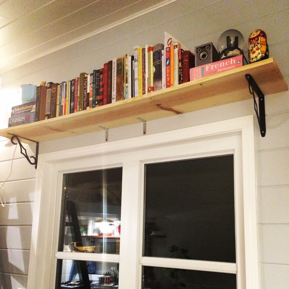  Our bookshelf above our large window in our living room. 