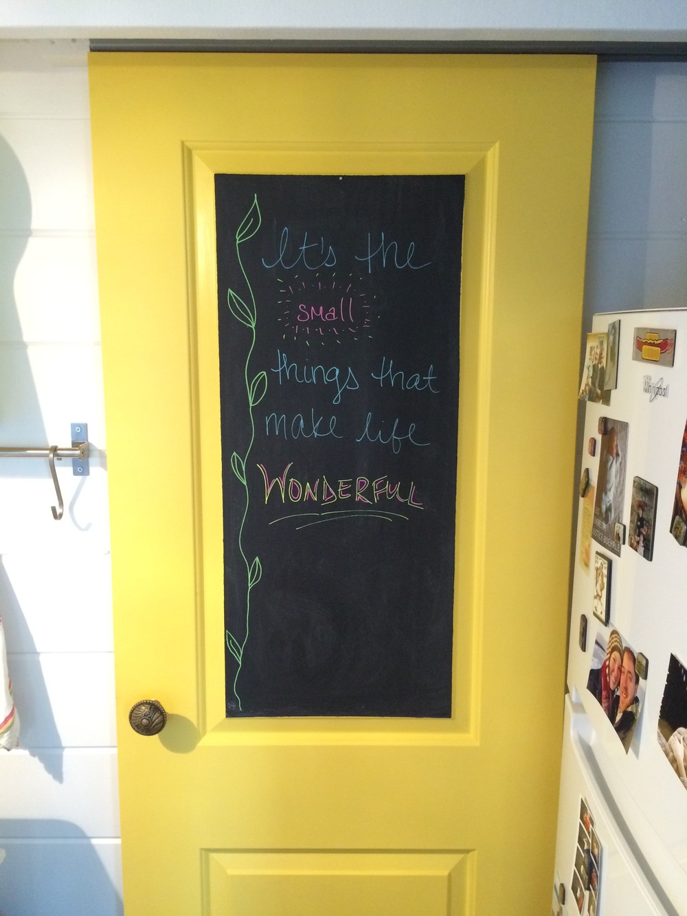  Our sliding yellow door to the bathroom. Has a chalkboard on it but our full-length mirror most often is hanging on it and covers the chalkboard. 