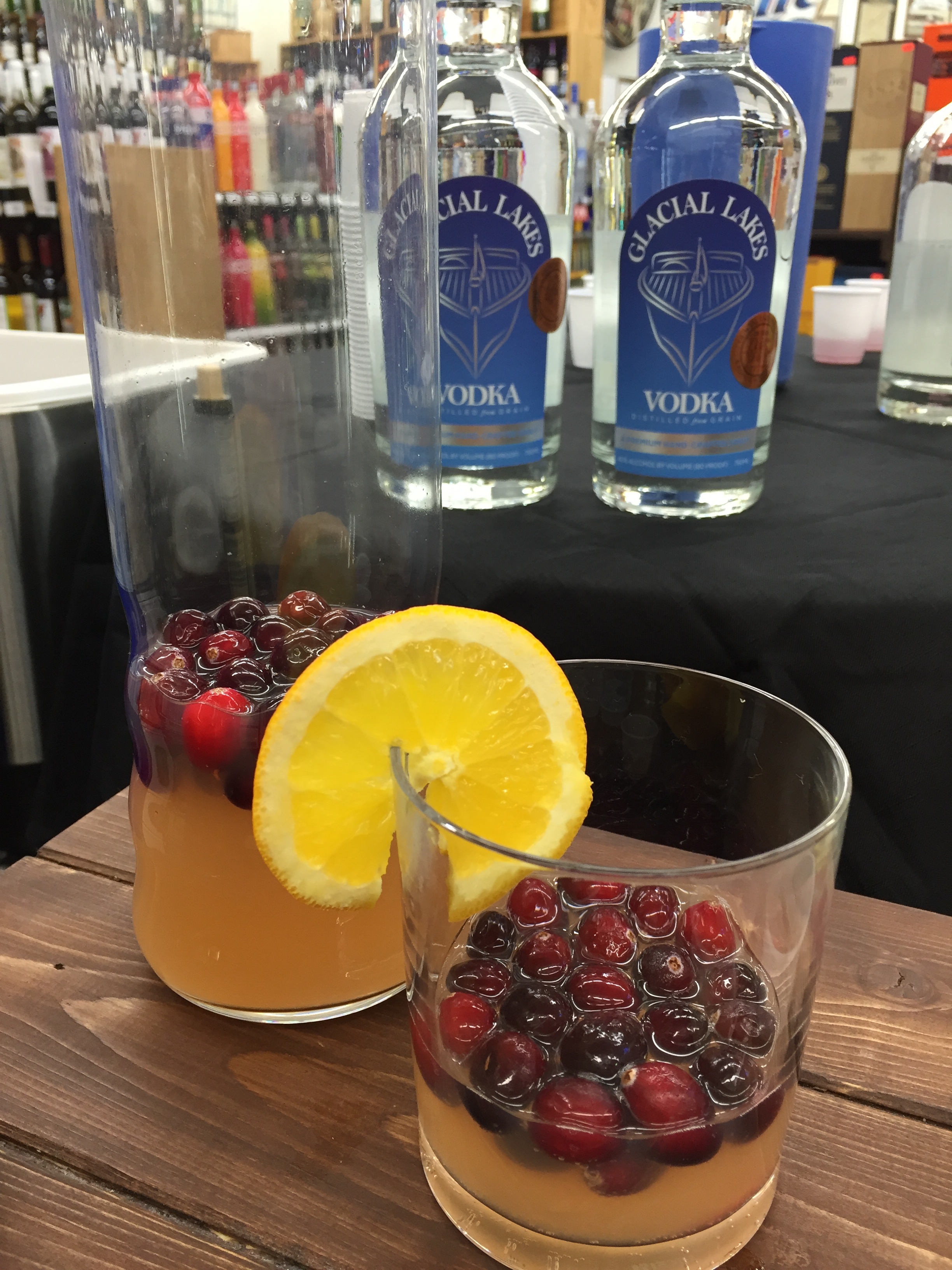1 part Glacial Lakes Vodka 3 part Tonic Water Splash of Cranberry Juice Splash of Orange Juice Garnish with Frozen Cranberries and Slice of Orange