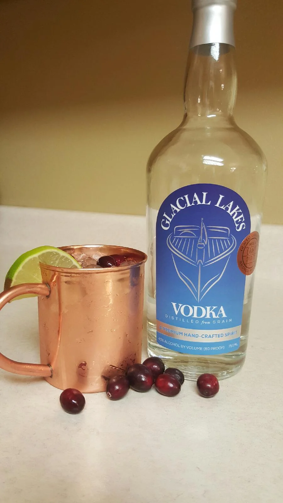 1.5 oz GLACIAL LAKES VODKA1.5 oz cRANBERRY jUICEfILL WITH CRANBERRY GINGER BEERSPLASH OF lIME jUICEGARNISH WITH fRESH OR FROZEN CRANBERRIESsERVE ON CRUSHED ICE