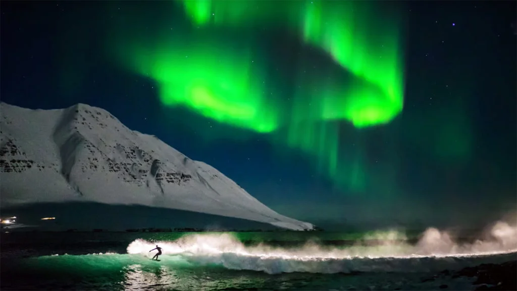SurfingUnderNorthernLights-1024x576.jpg