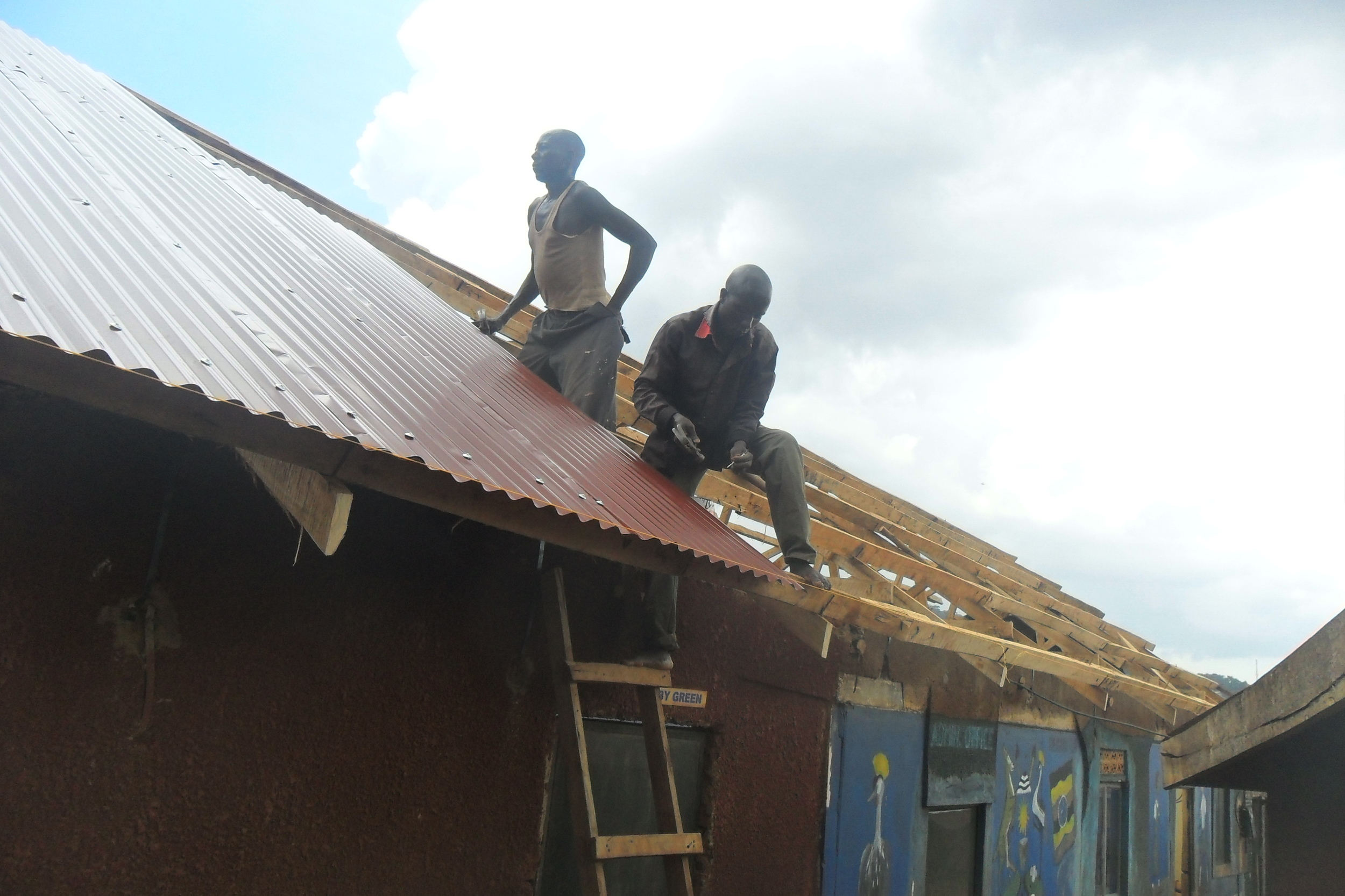 pictures showing ironsheets on top of the building.jpg