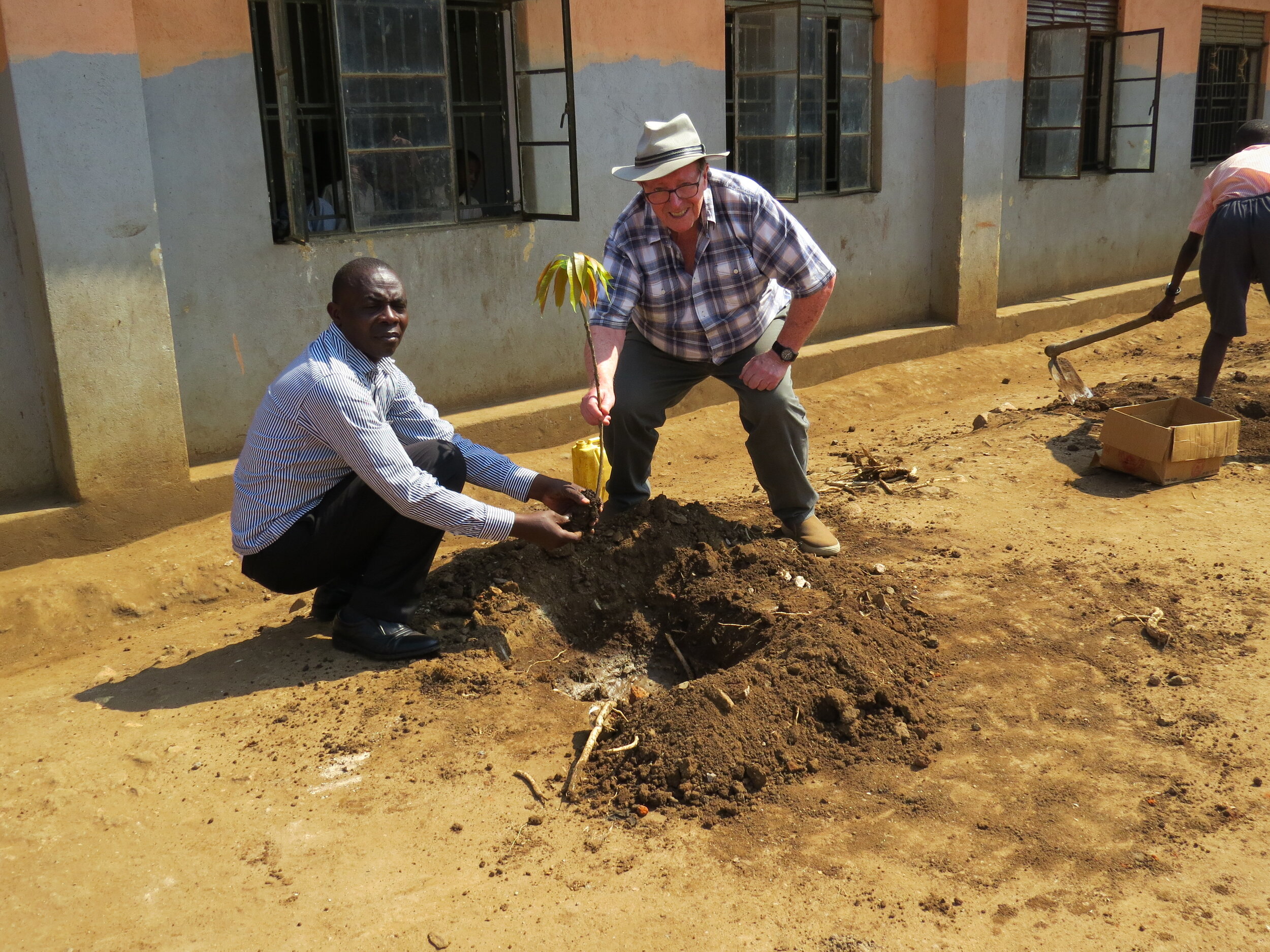 Planting trees behind classrooms 2019