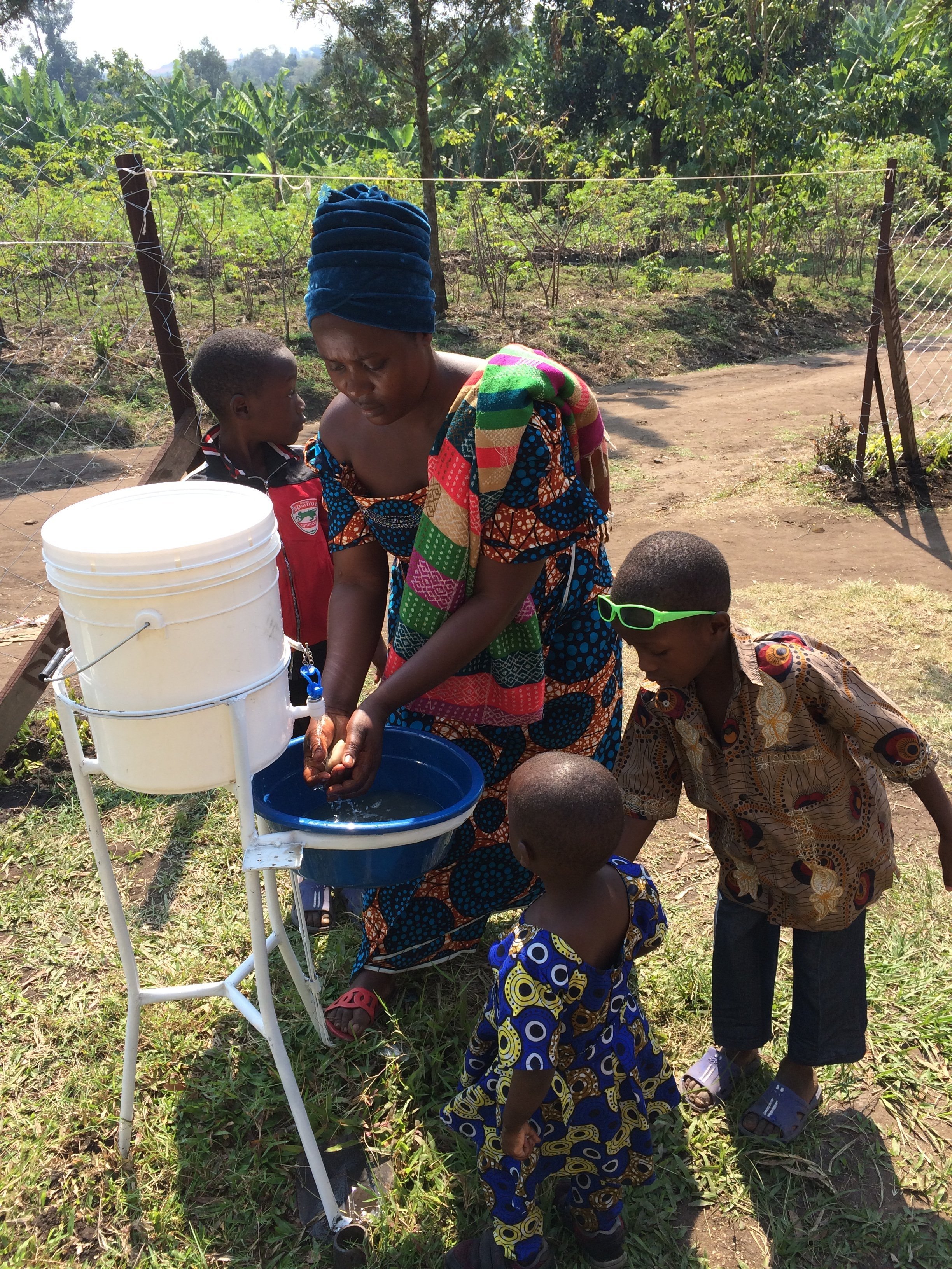 A+Mother+with+her+children+washing+hands.jpg