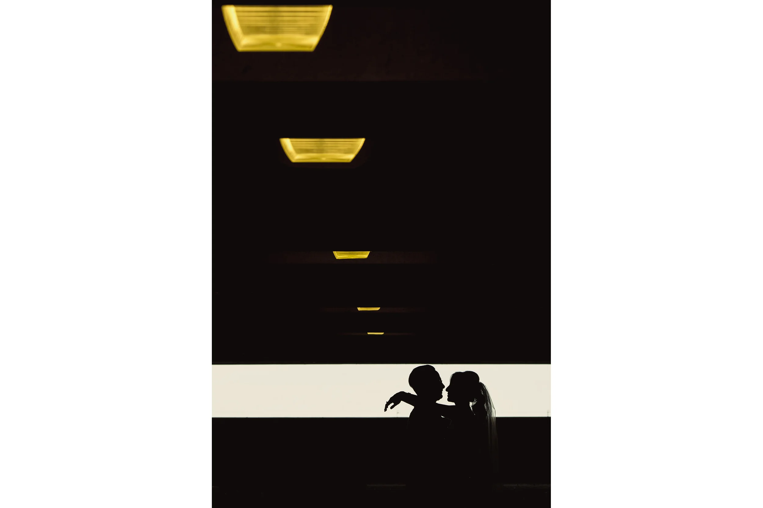 bride and groom silhouette in a parking garage at brookstreet hotel