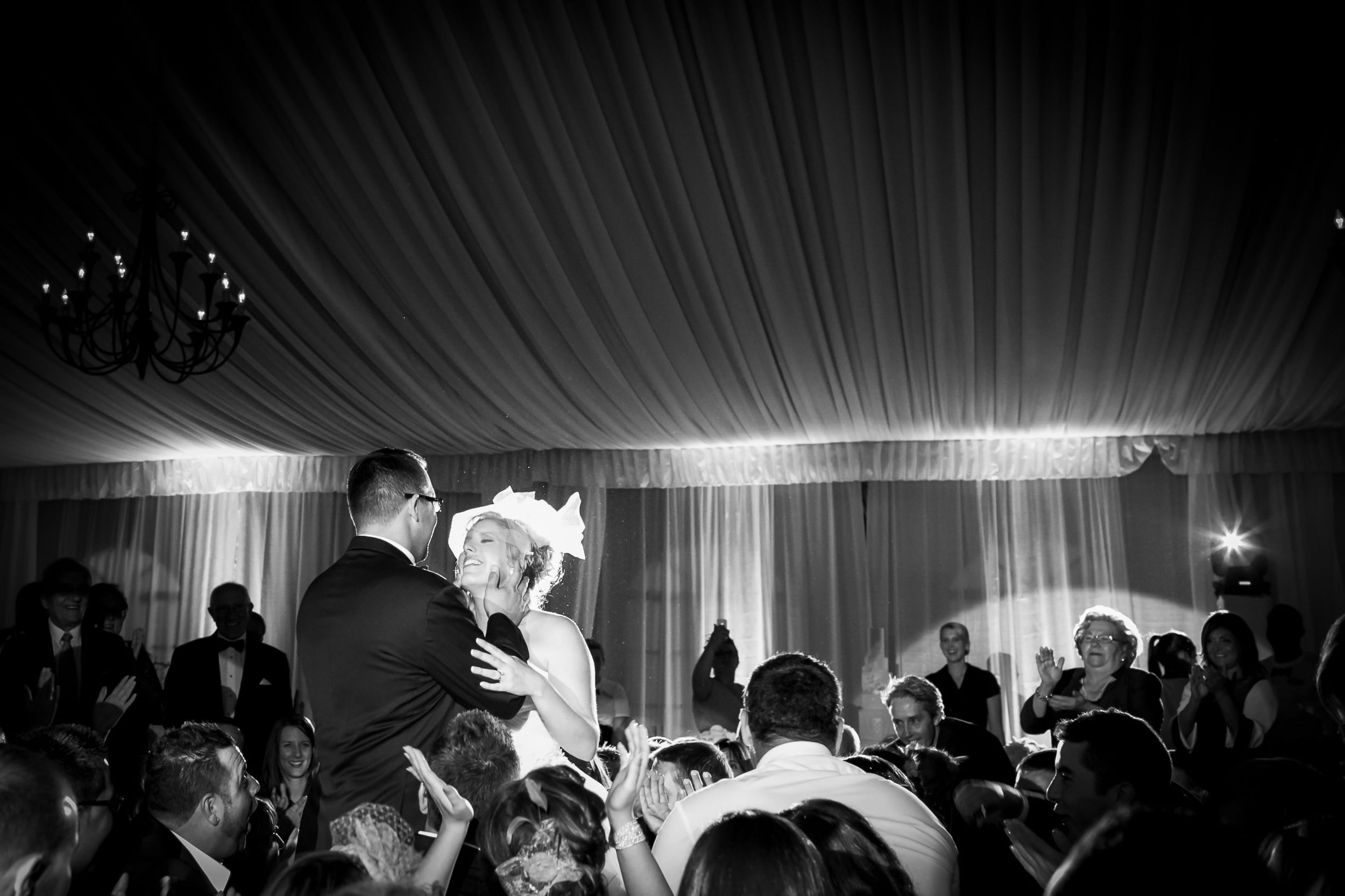 bride and groom kissing at their wedding reception (Copy)