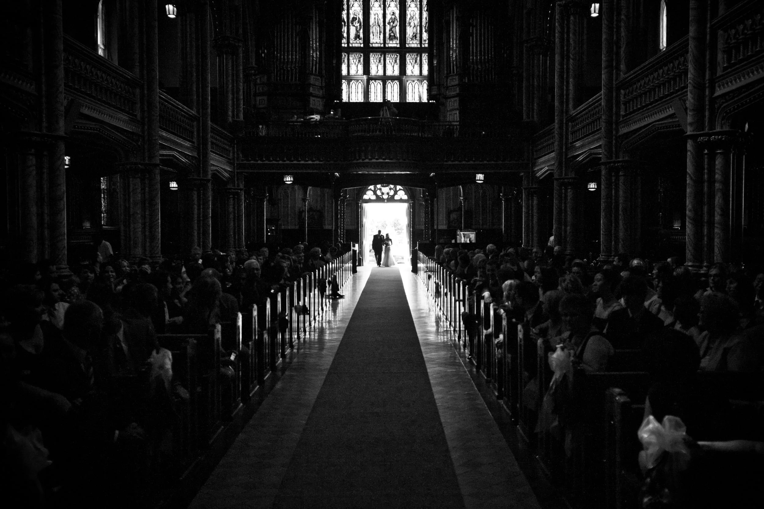 bride walking down isle in church