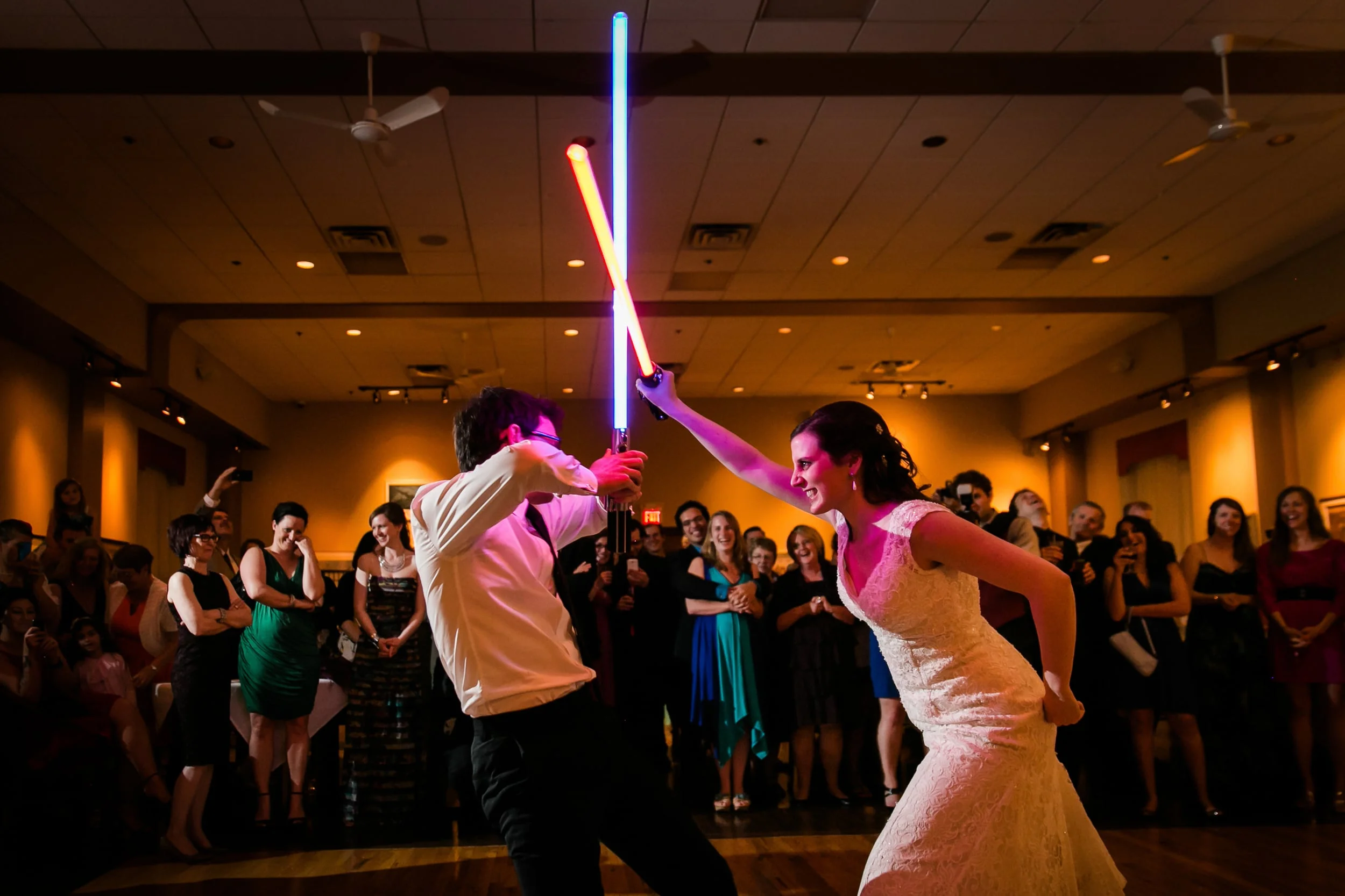 star wars lightsaber battle at a wedding reception
