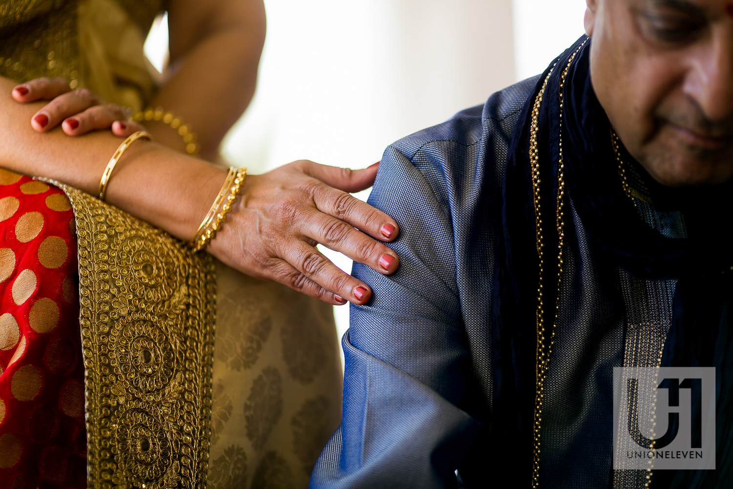  indian brides mother and father at a mendhi ceremony 