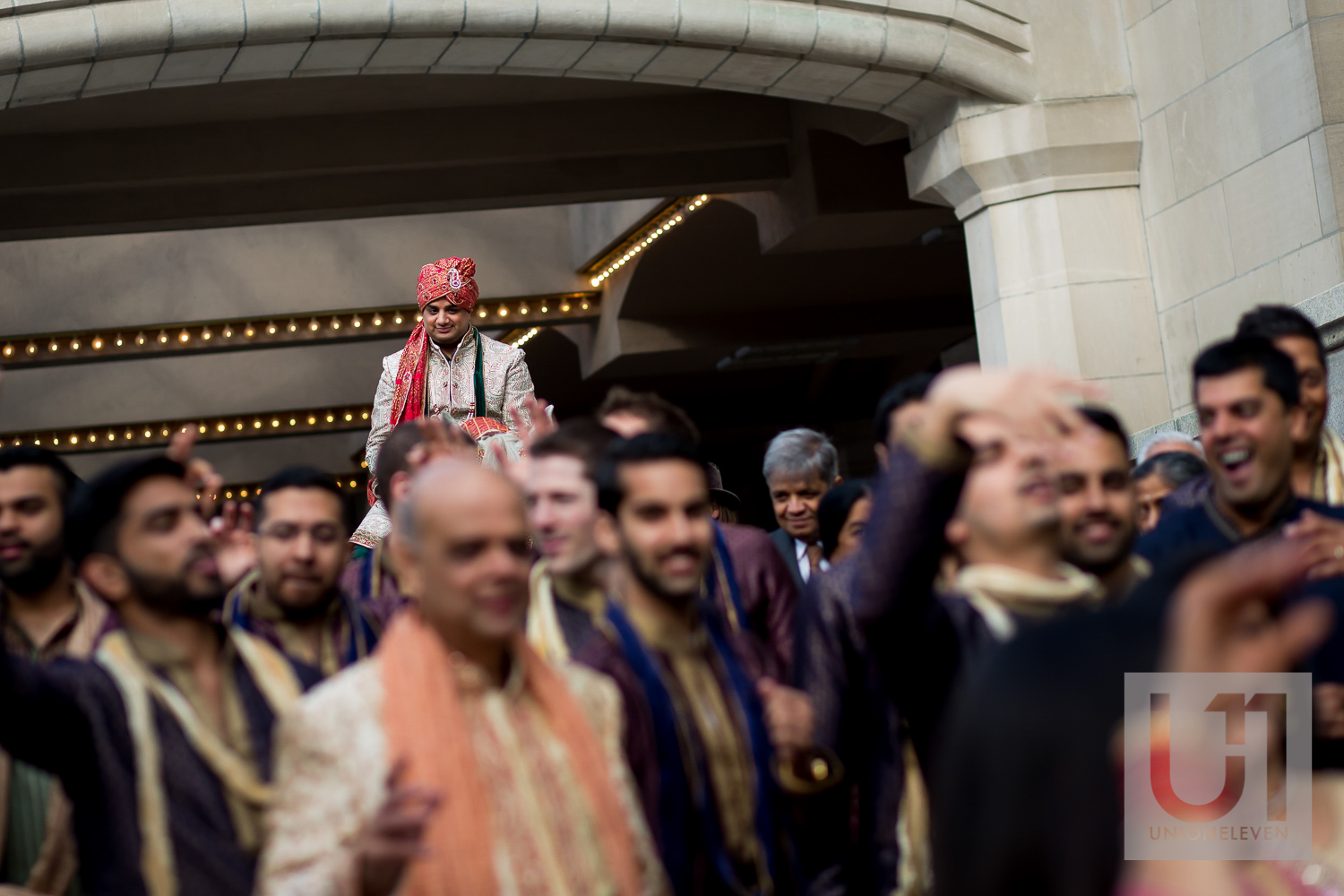 indian groom getting onto a horse