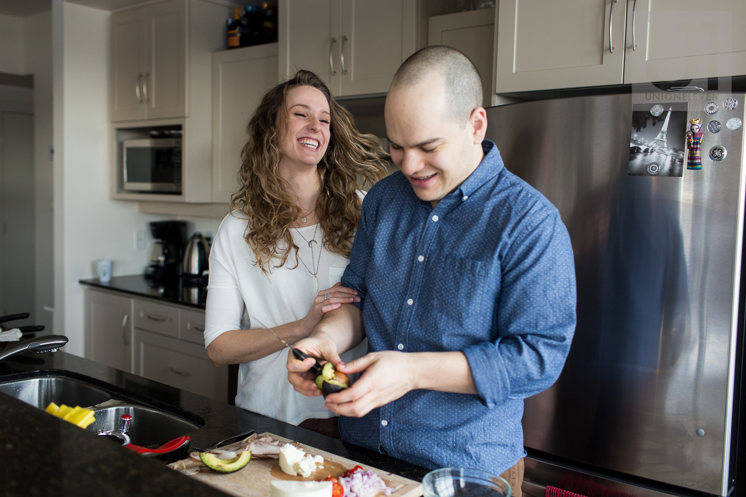 couple-laughing-in-kitchen