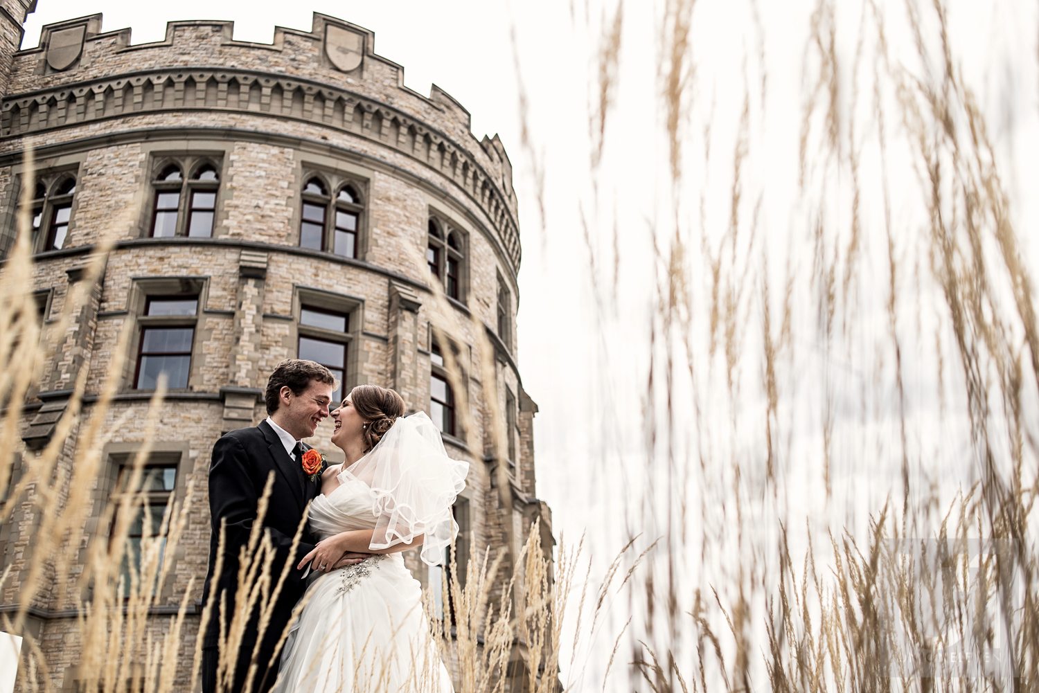 An outdoor photo of the bride and groom in front of the Museum of Nature, Ottawa
