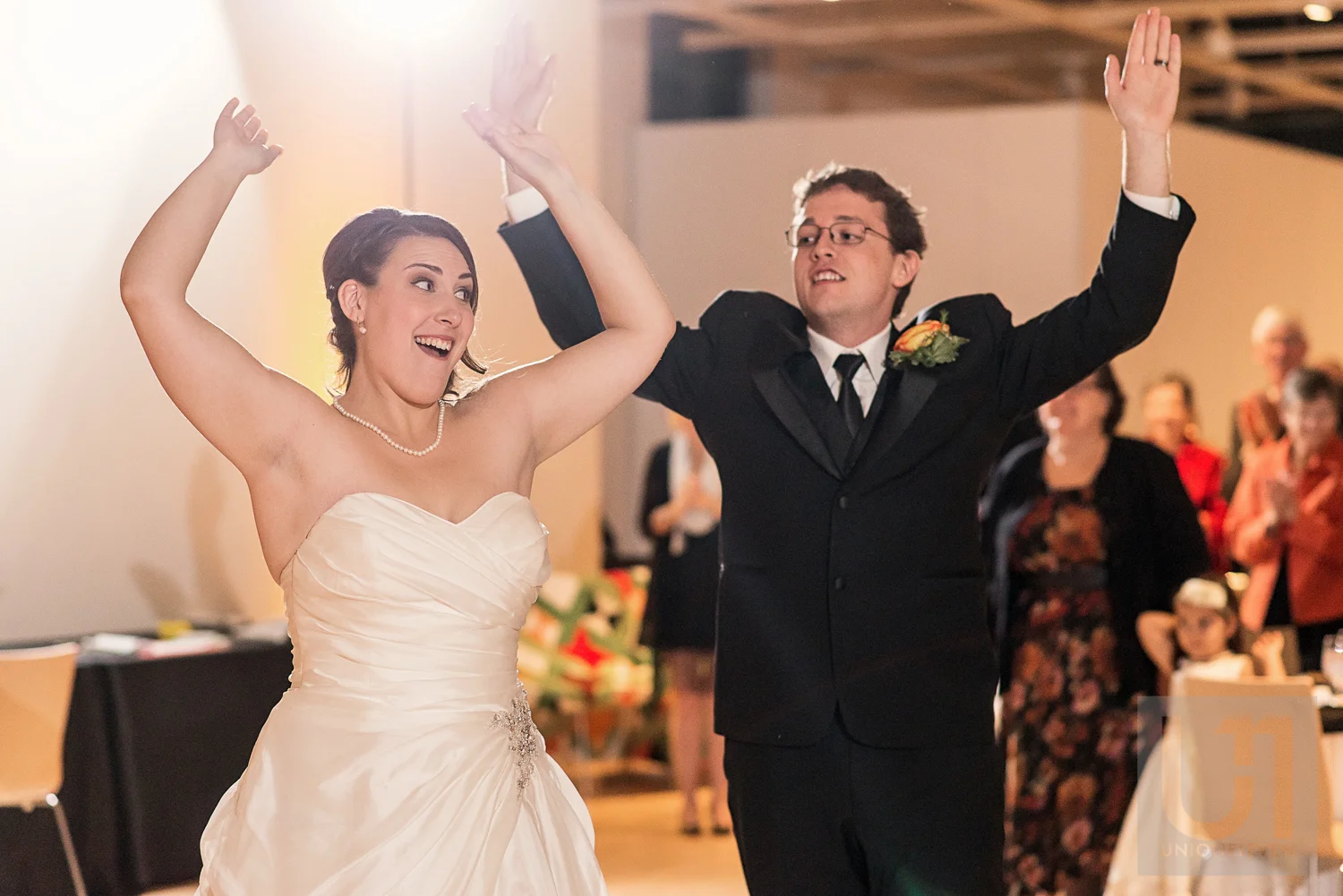 The bride and groom making their entrance into the wedding reception