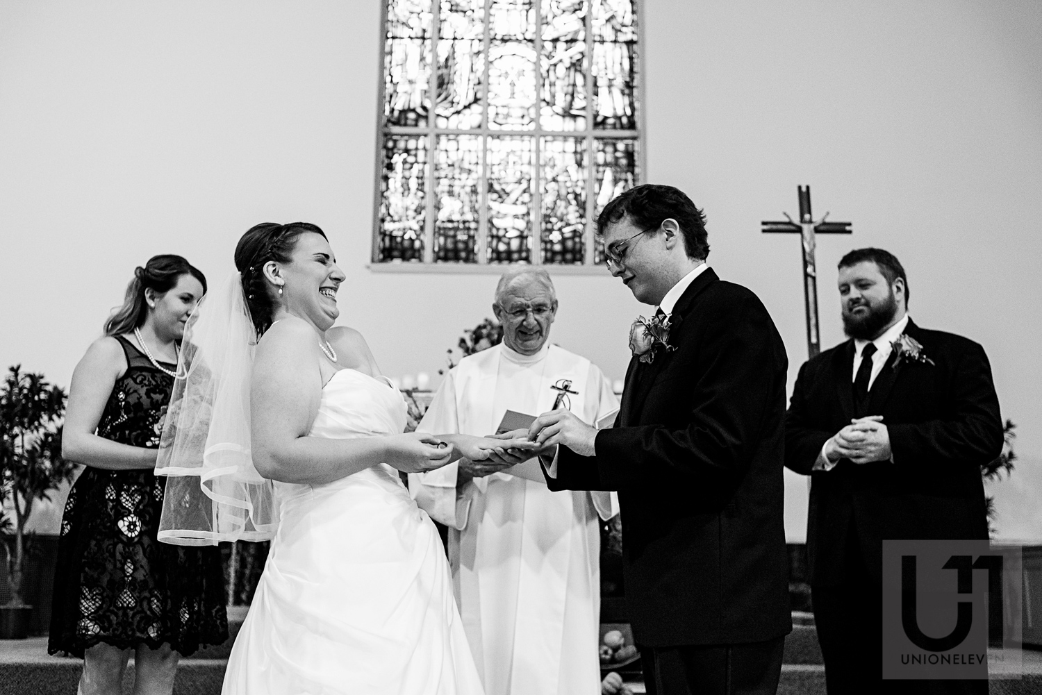 The bride and groom exchanging their wedding rings