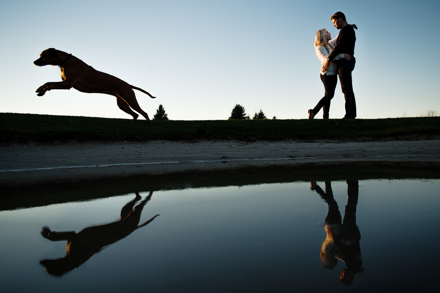 couple with reflection with dog