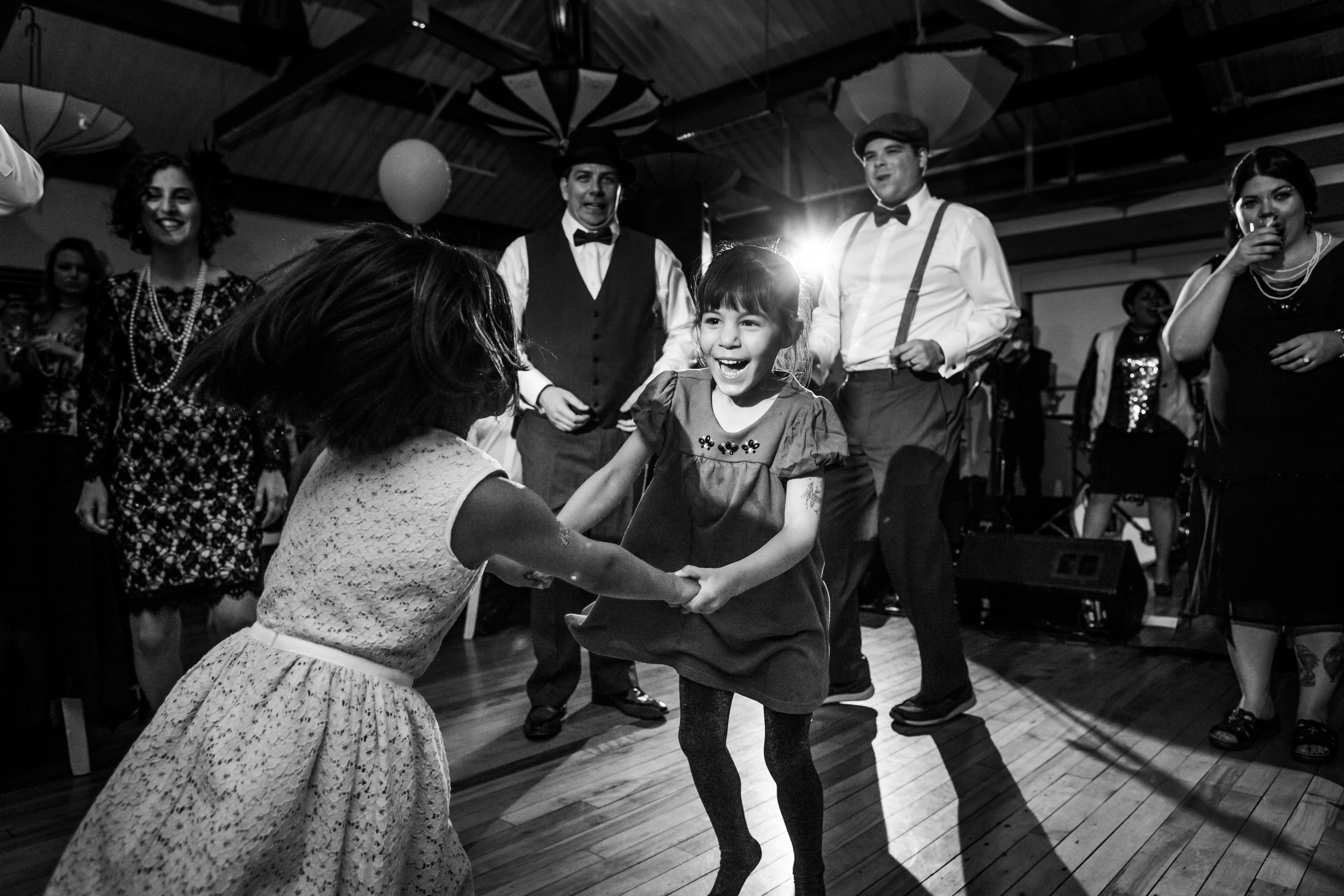 A few young guests dancing at the wedding reception