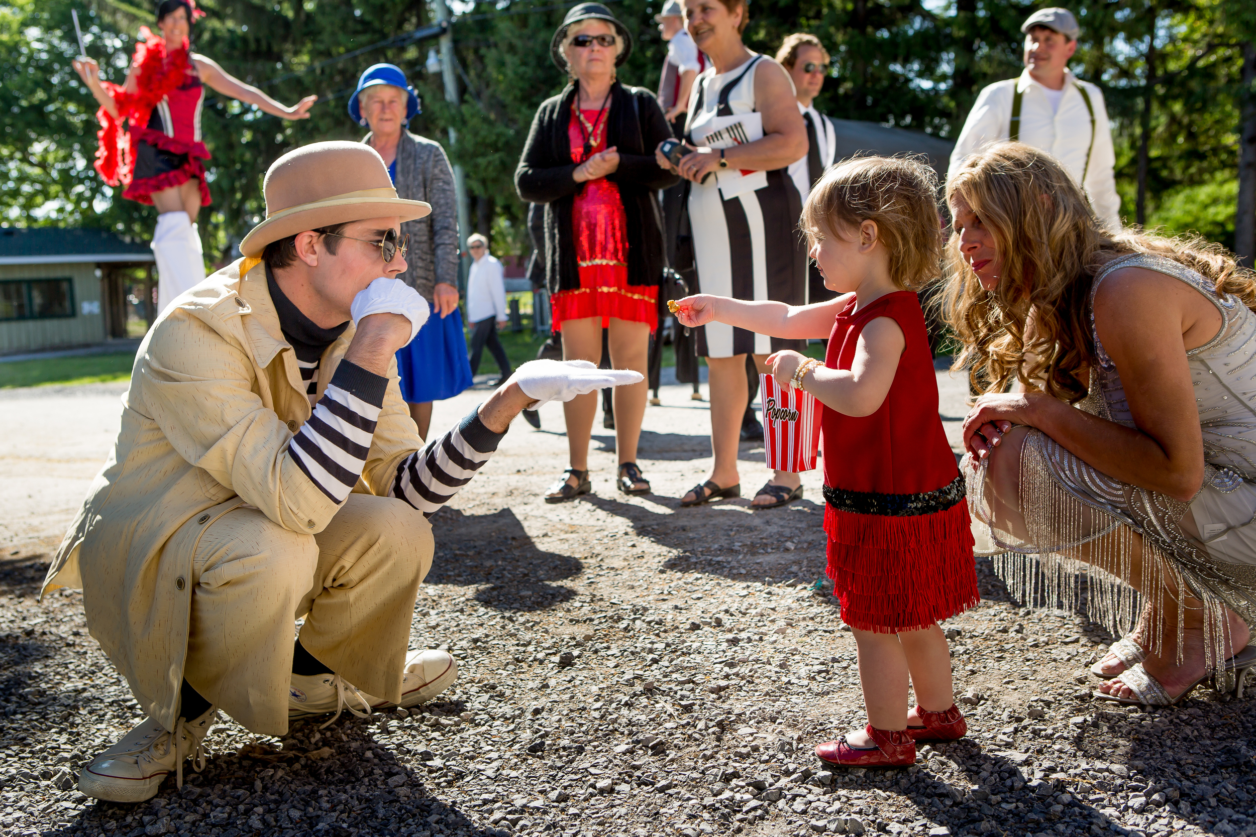 A circus performer entertaining a young guest before the wedding reception 