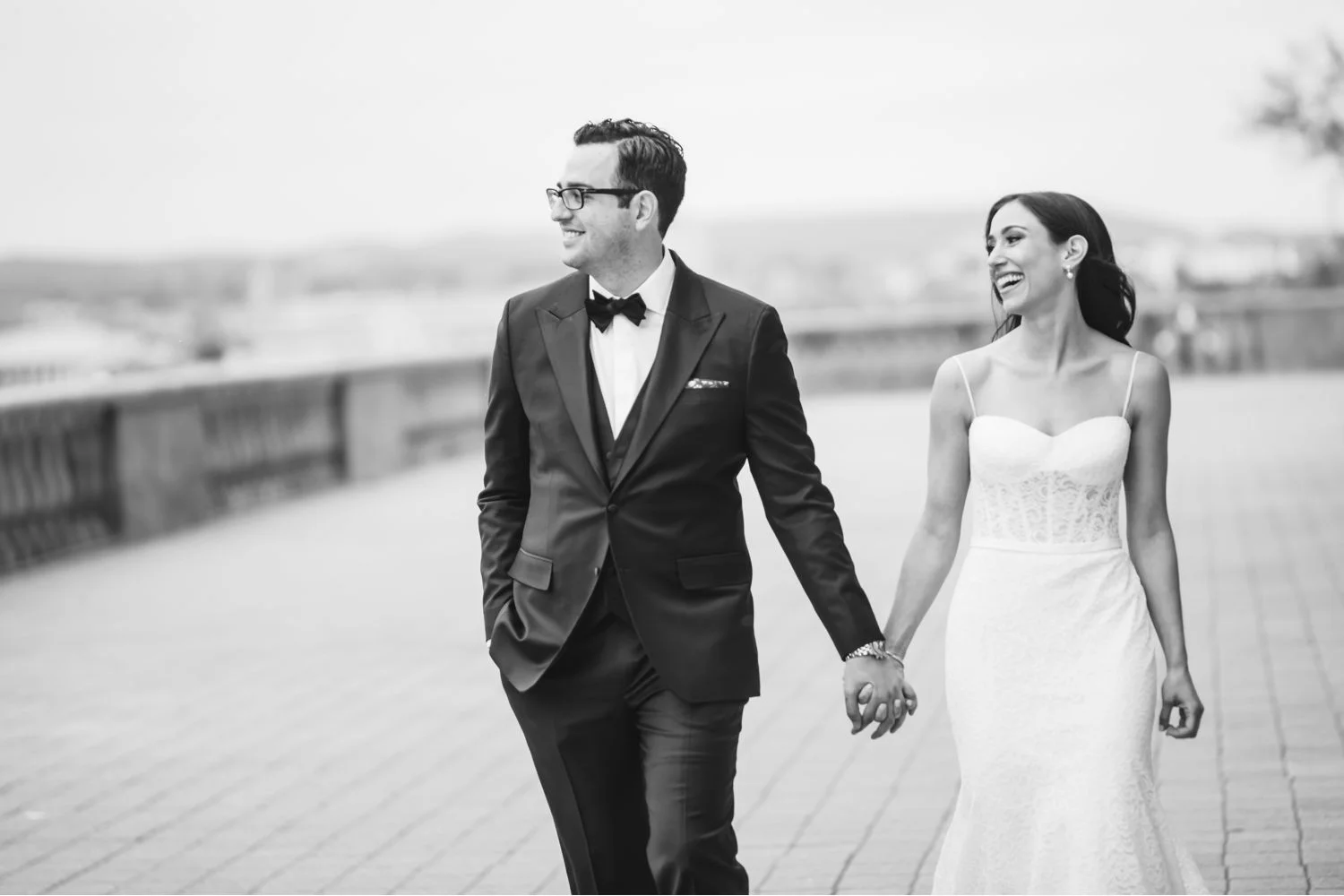 ride and groom take walk on chateau laurier terrace after wedding ceremony