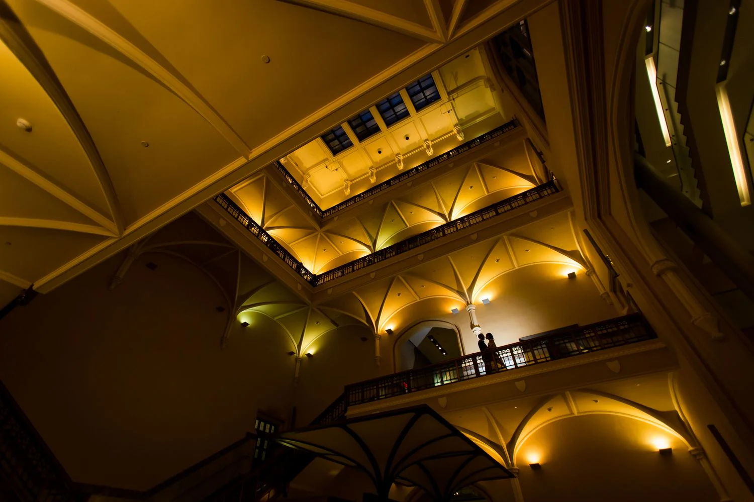 A night portrait of the bride and groom after their wedding reception at The Museum of Nature