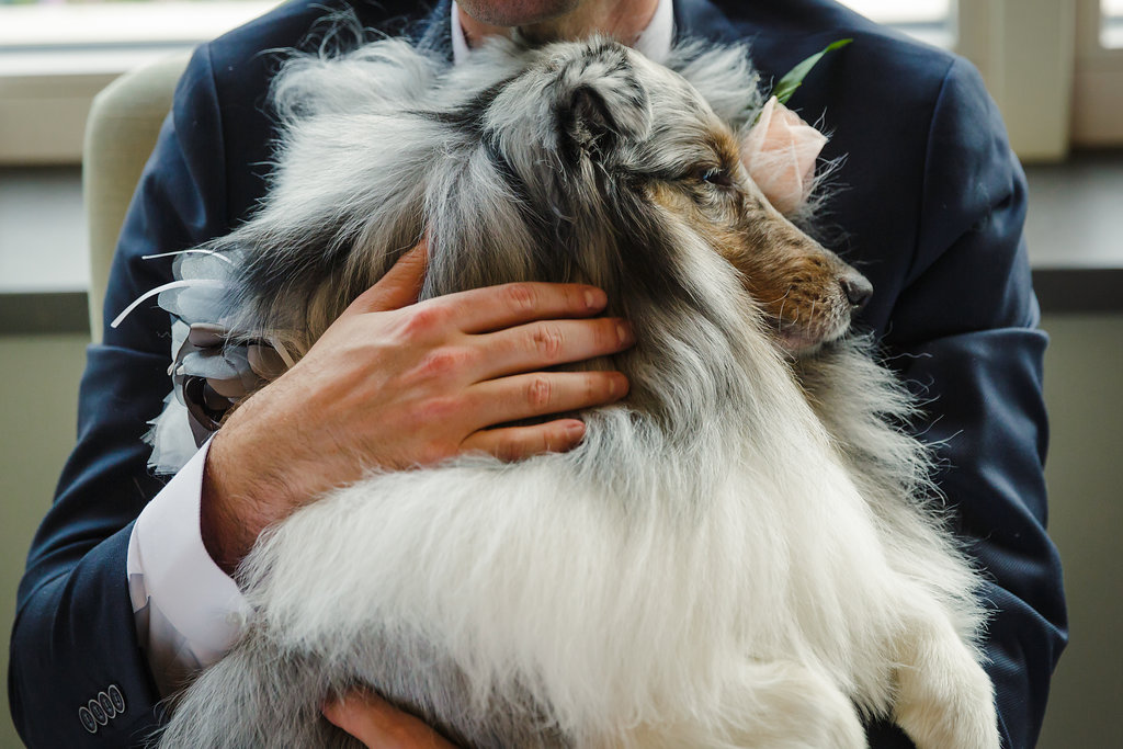 groom and his pet dog