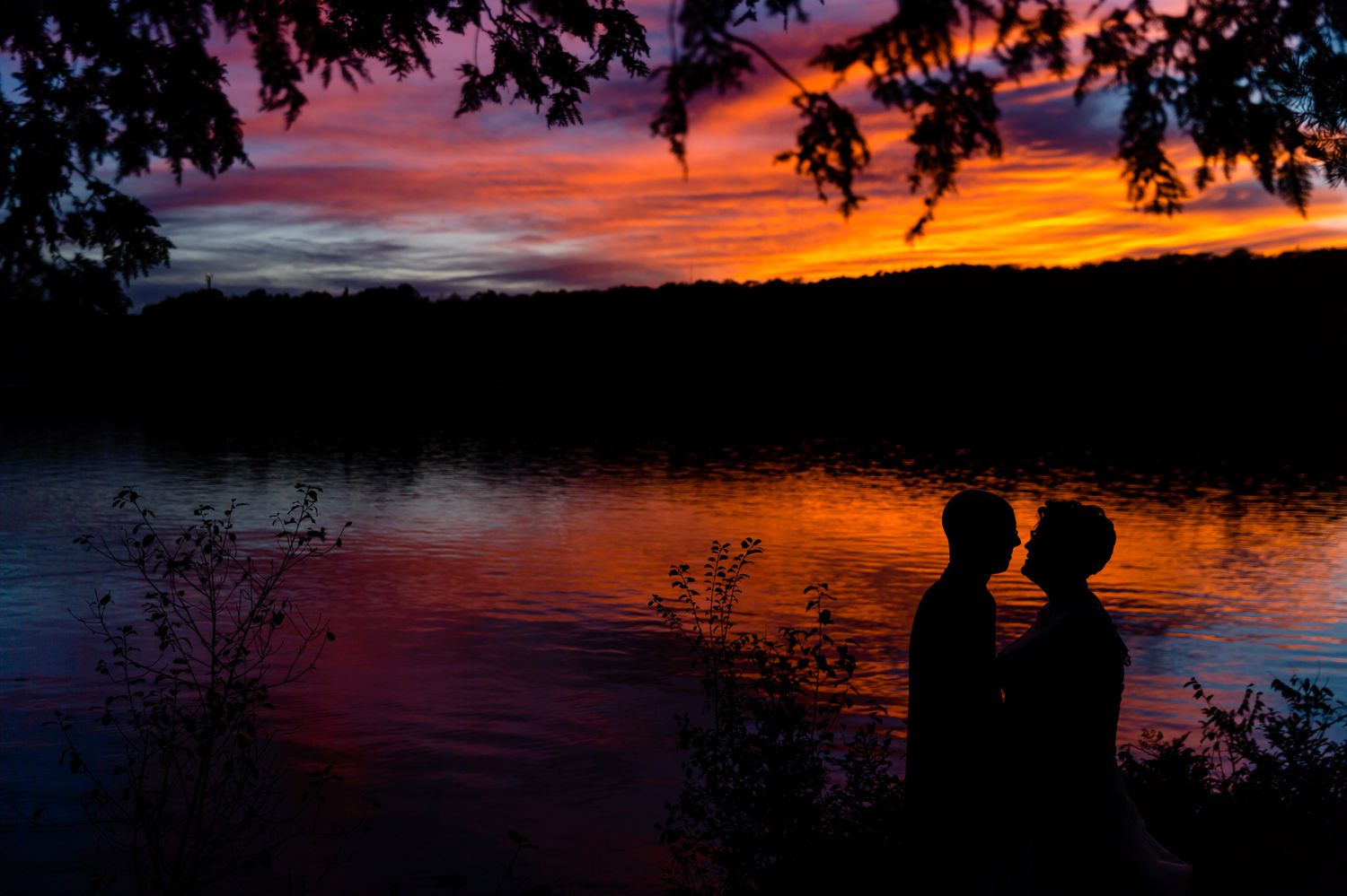 A portrait of the bride and groom taken at sunset at La Grange de la Gatineau