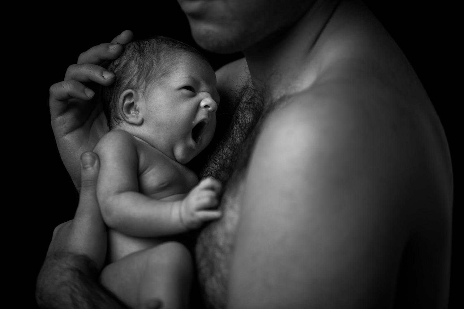 artistic photograph of a baby and her father