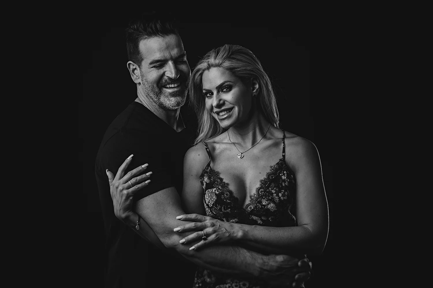 couples portrait on black and white portrait on a black background ottawa in studio portrait photographer