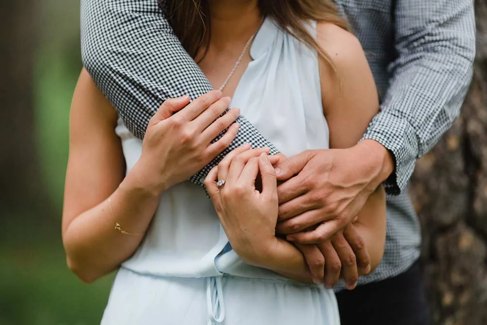 close up of a couple embracing during their engagement shoot
