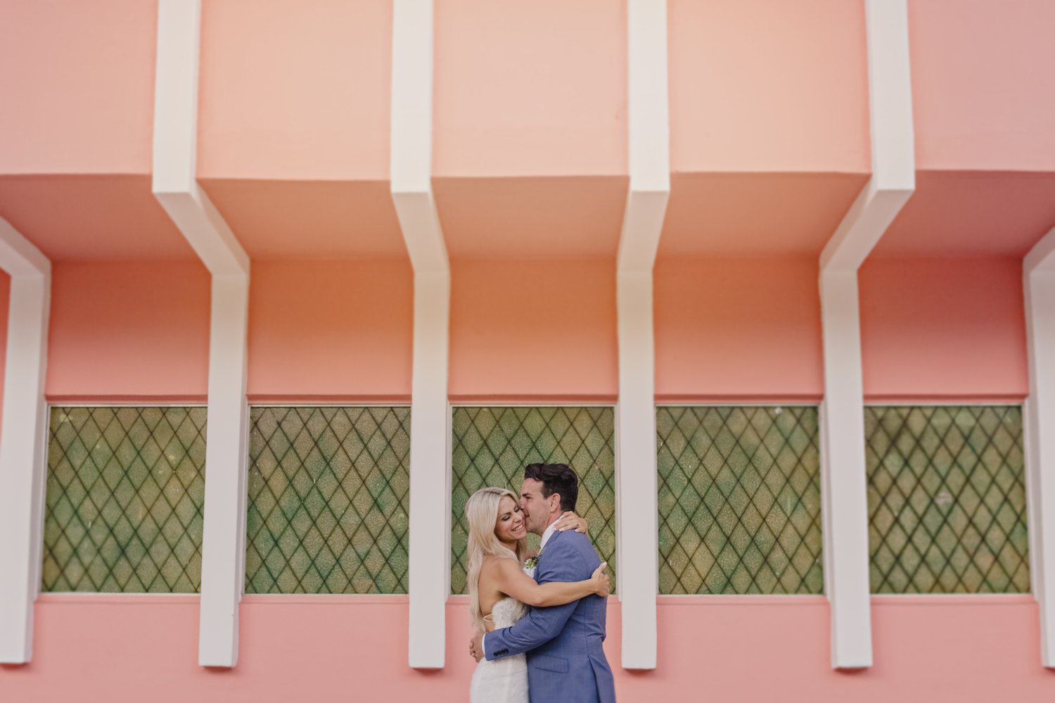 wedding couple portrait on a pink wall in miami florida w hotel south beach