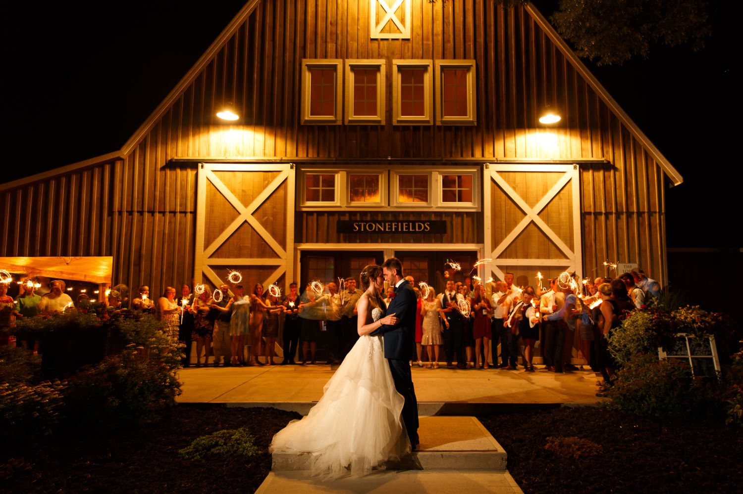 A night time portraits of the bride and groom taken outside Stonefields Estate