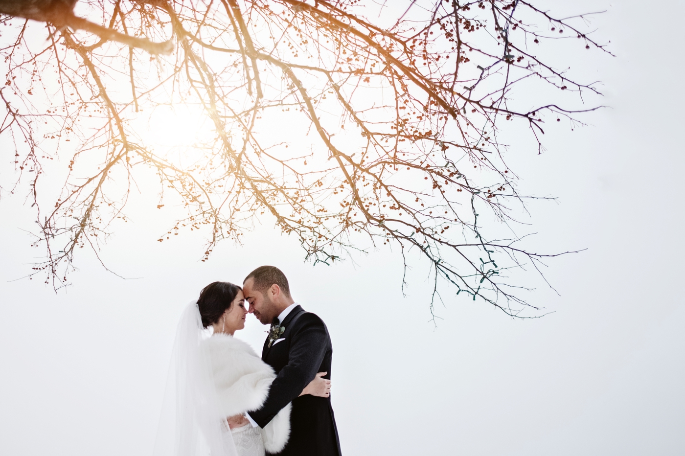 a winter portrait of a bride and groom at the hotel quintessence in mont tremblant quebec