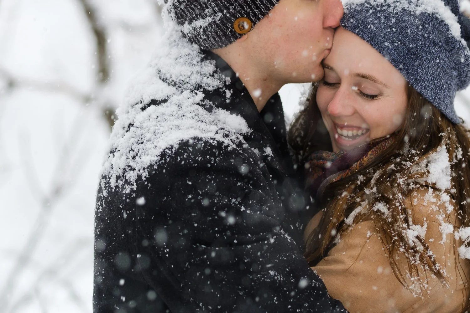 a winter engagement photo in the arboretum in ottawa