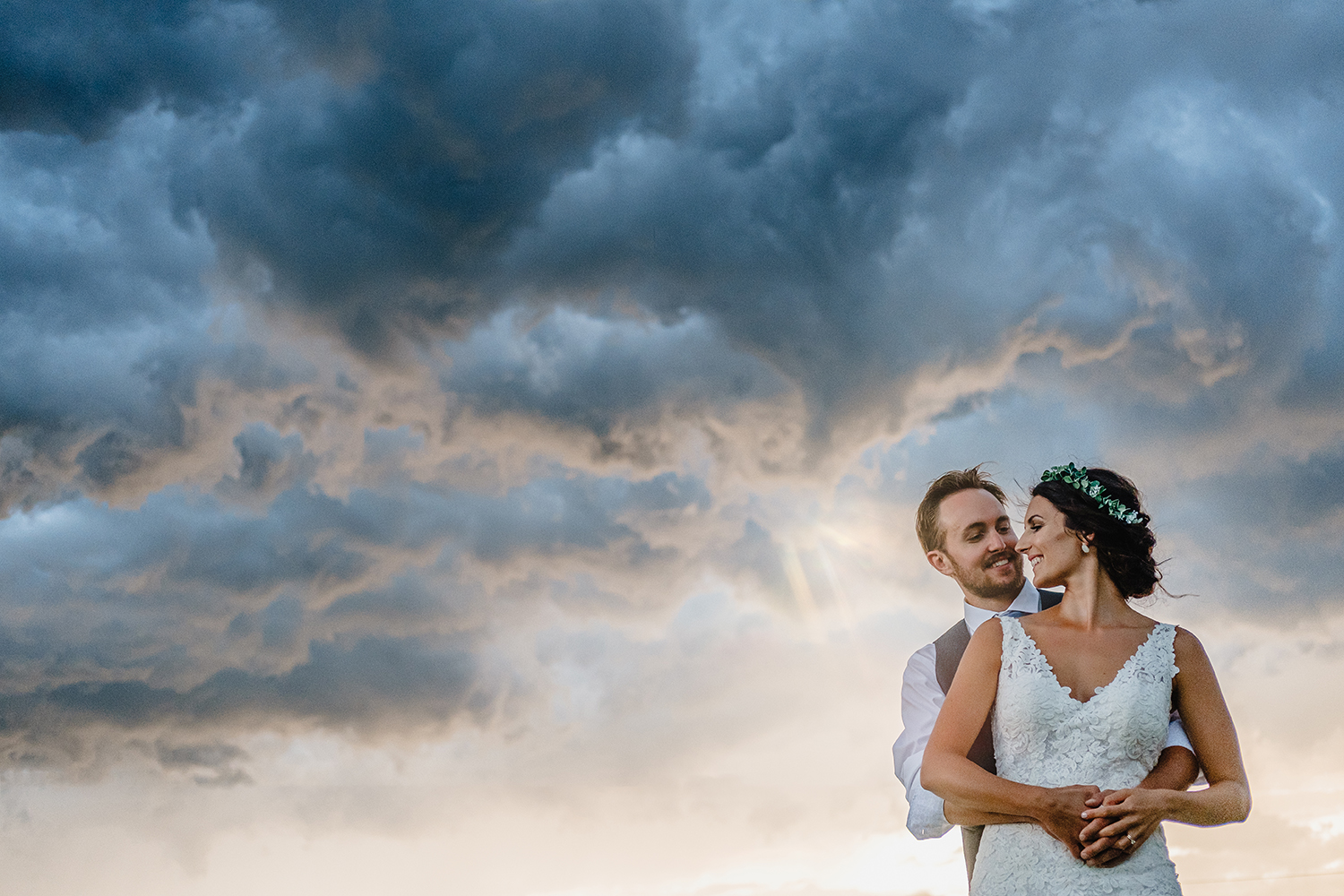 photo of bride and groom with a stormy sky during a metcalfe ontario wedding reception