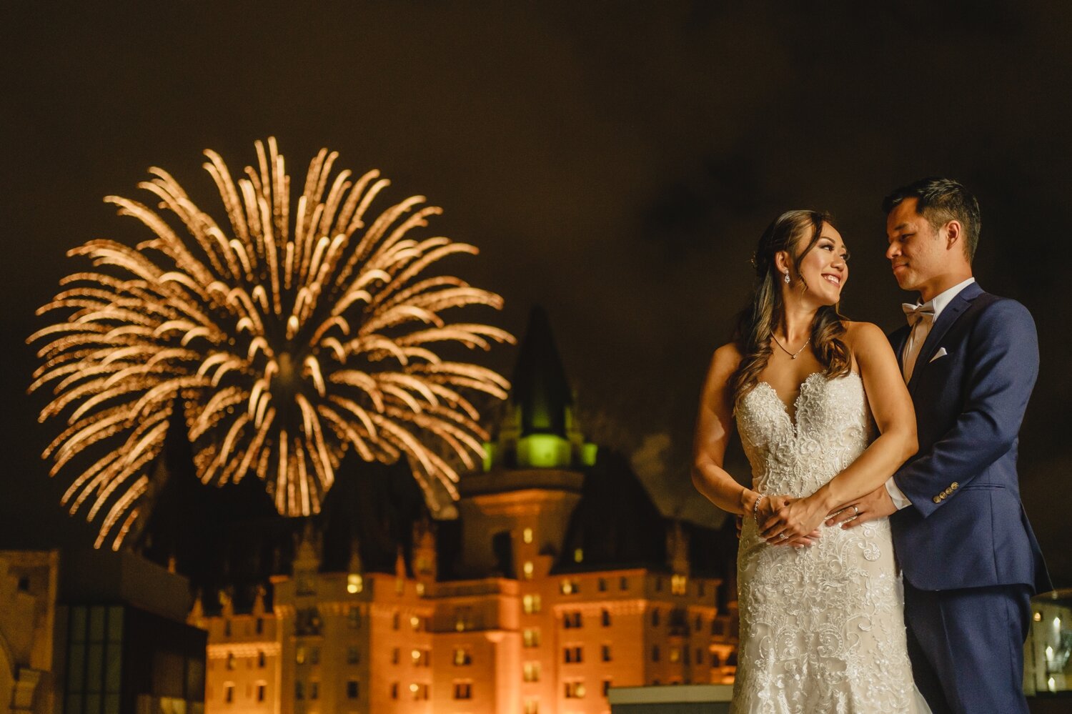 photo of bride and groom with fireworks during a venue twenty two wedding reception at the westin ottawa ontario